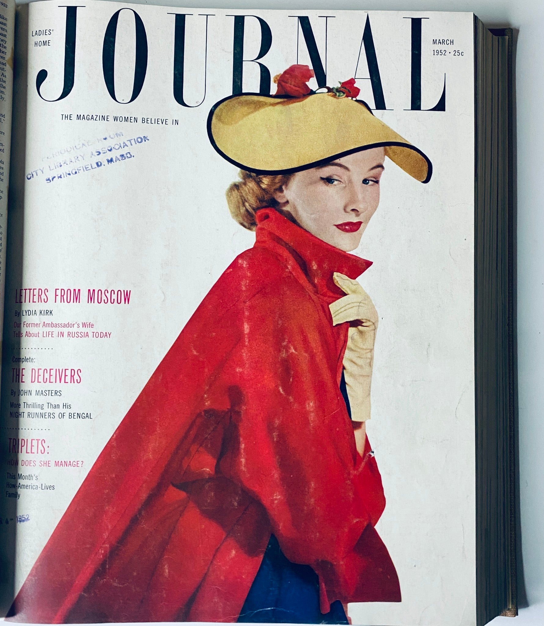 Cover of the March 1952 issue of Ladies' Home Journal, depicting a fashionable woman in a dramatic red cape and hat, representative of the trends during the era in the Ladies' Home Journal Library Bound Magazine 1952 Full Year January - December.