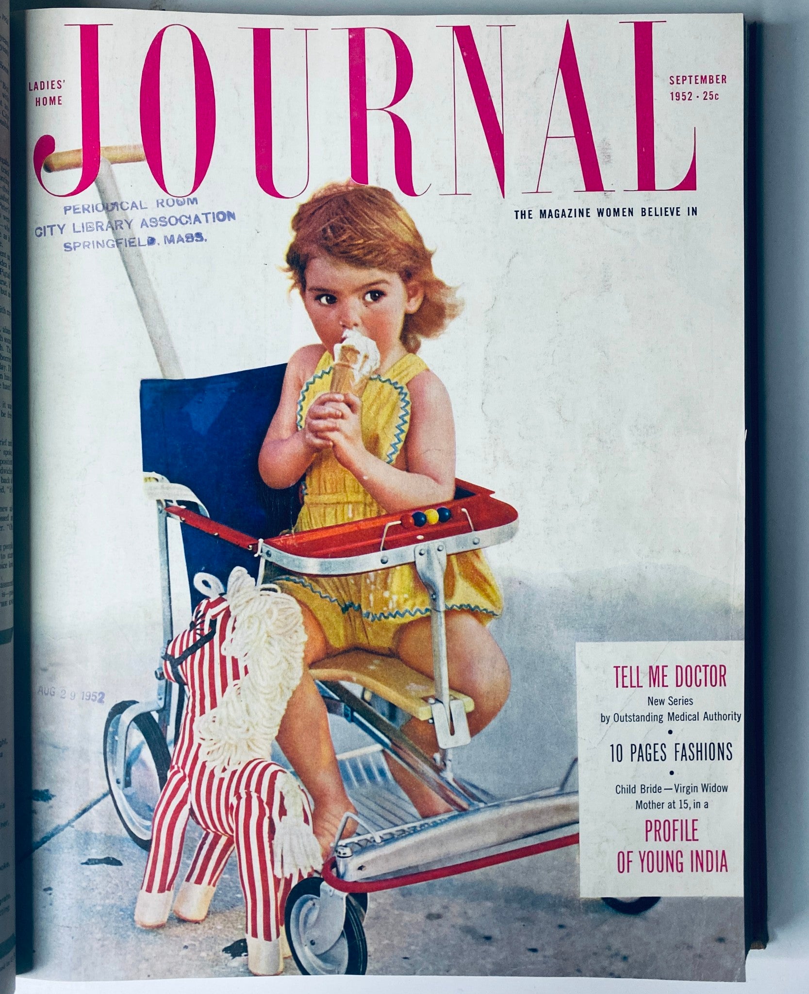 Cover of Ladies' Home Journal September 1952 featuring a young girl with ice cream in a stroller, highlighting themes of family and childhood culture.