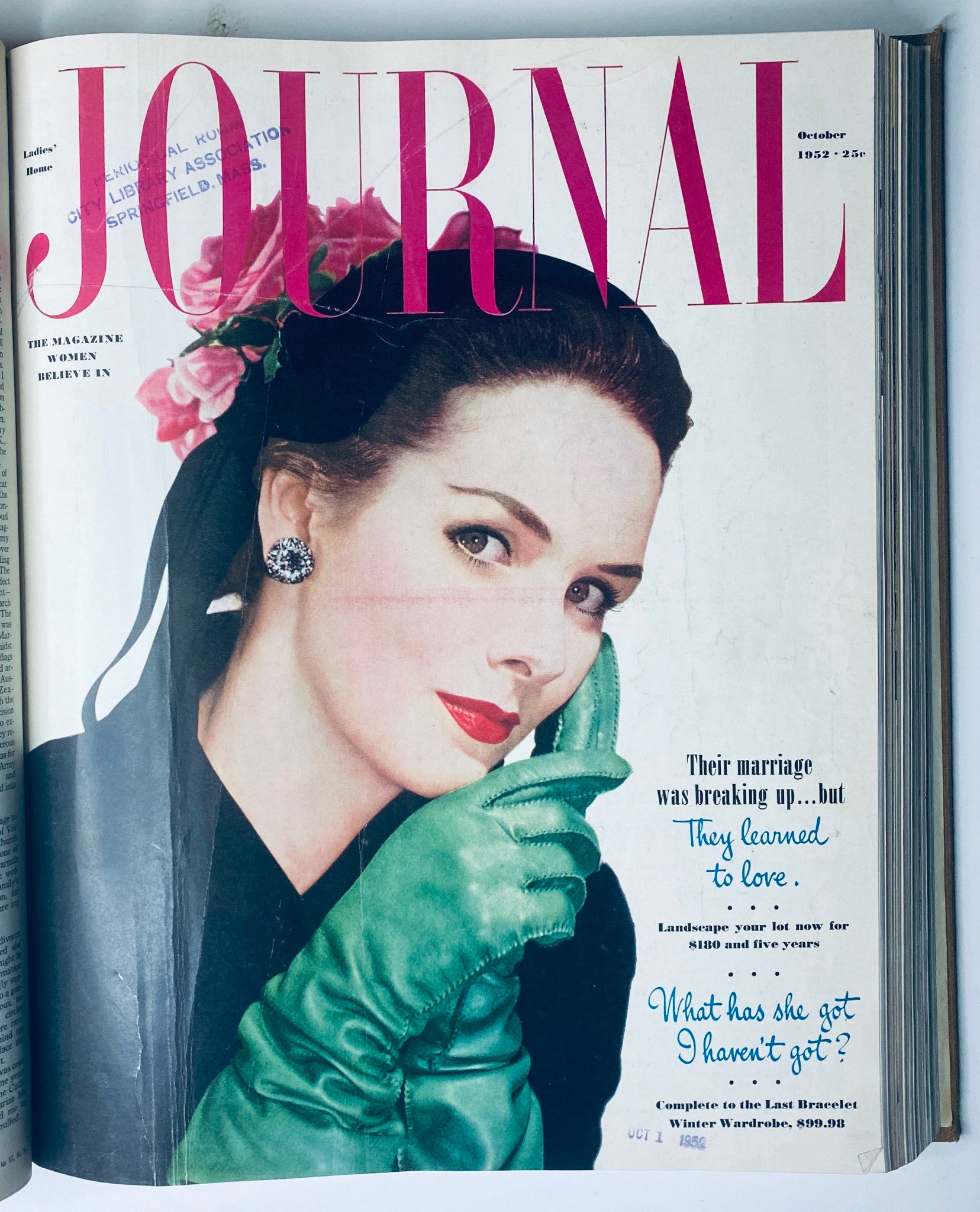 Cover of Ladies' Home Journal October 1952 showcasing a glamorous woman with a fashionable look, reflecting mid-century style and beauty trends.