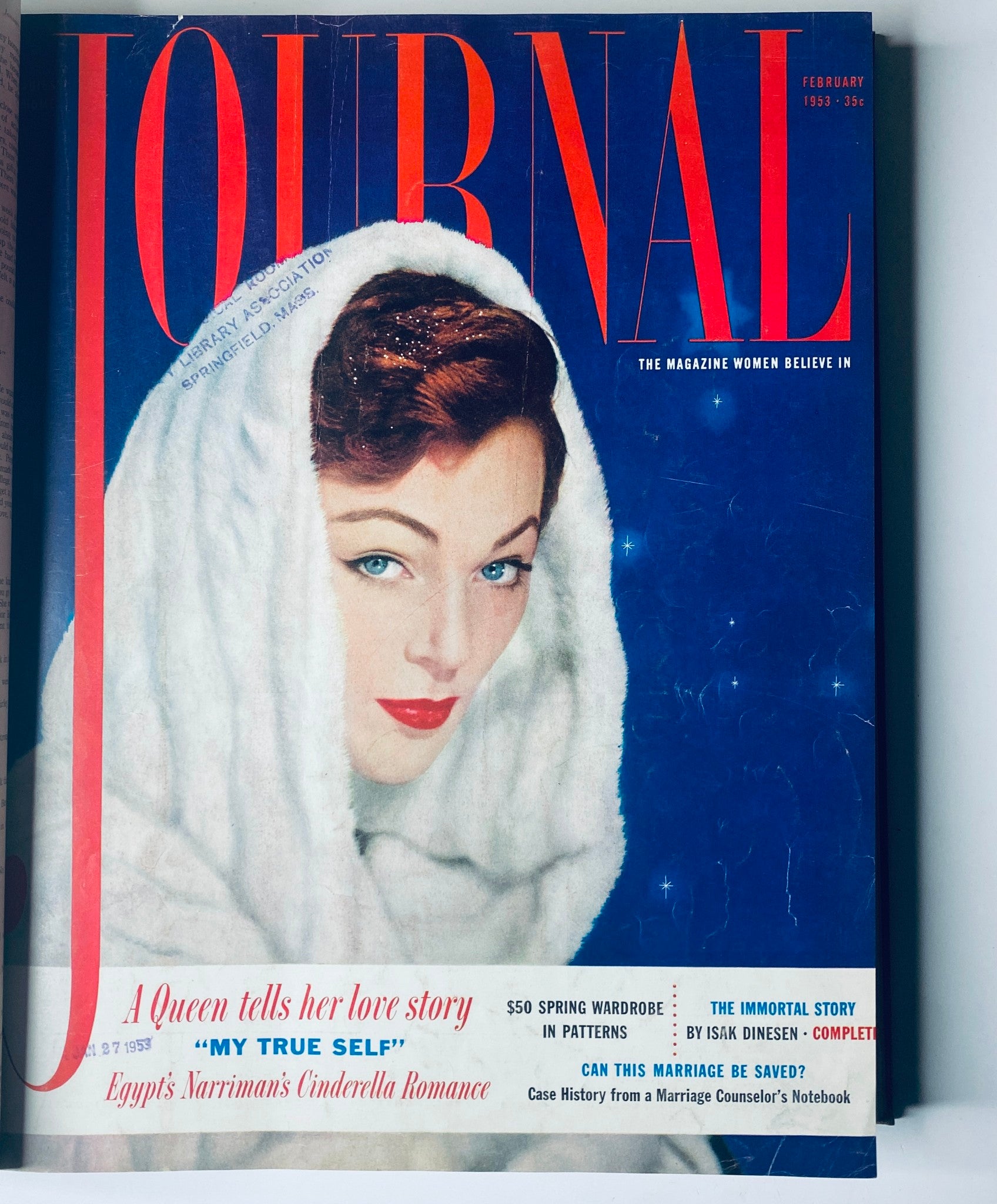 Cover of Ladies' Home Journal, February 1953 edition, featuring a woman wrapped in a white fur scarf, with striking blue eyes and the title 'Journal.' This image belongs to the Ladies' Home Journal Library Bound Magazine 1953 Full Year set.
