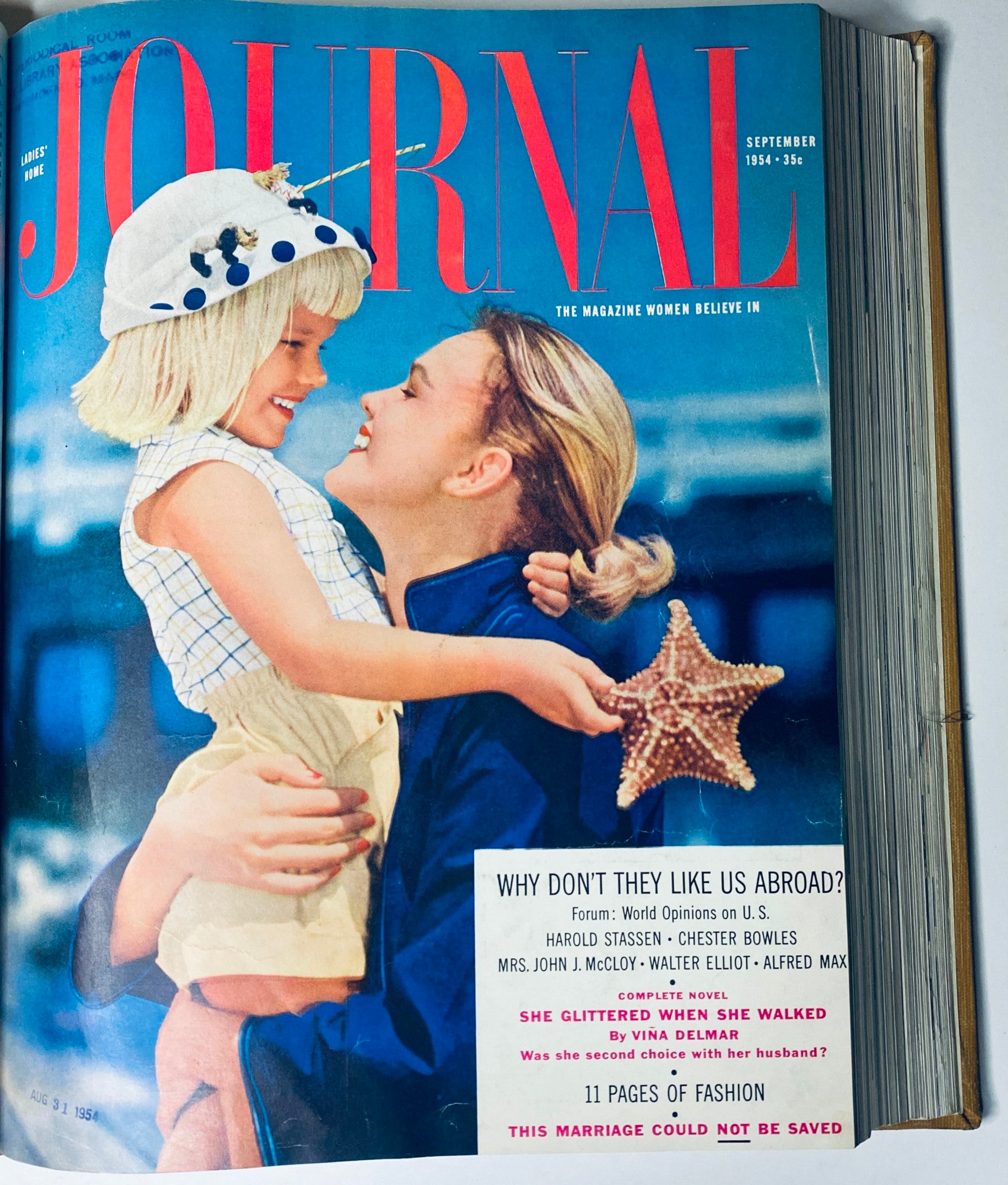 Cover of Ladies' Home Journal Magazine, September 1954 edition, showing a mother and daughter joyfully holding a starfish, linked to the title 'Ladies' Home Journal Library Bound Magazine 1954 Full Year January - December'.