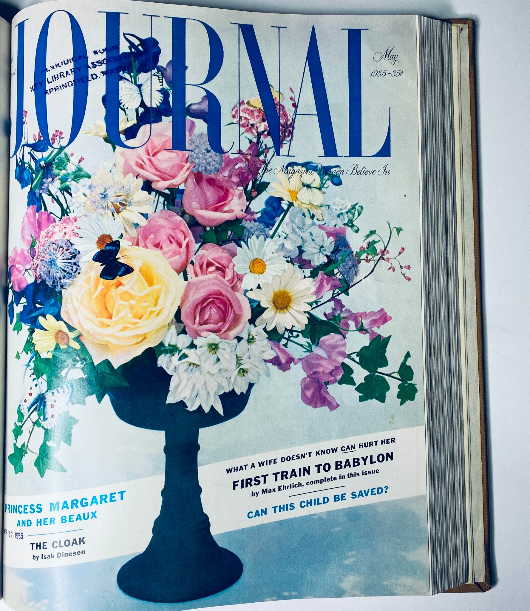 May 1955 cover of Ladies' Home Journal featuring a floral arrangement, highlighting the magazine's focus on home and garden lifestyle trends of the 1950s.
