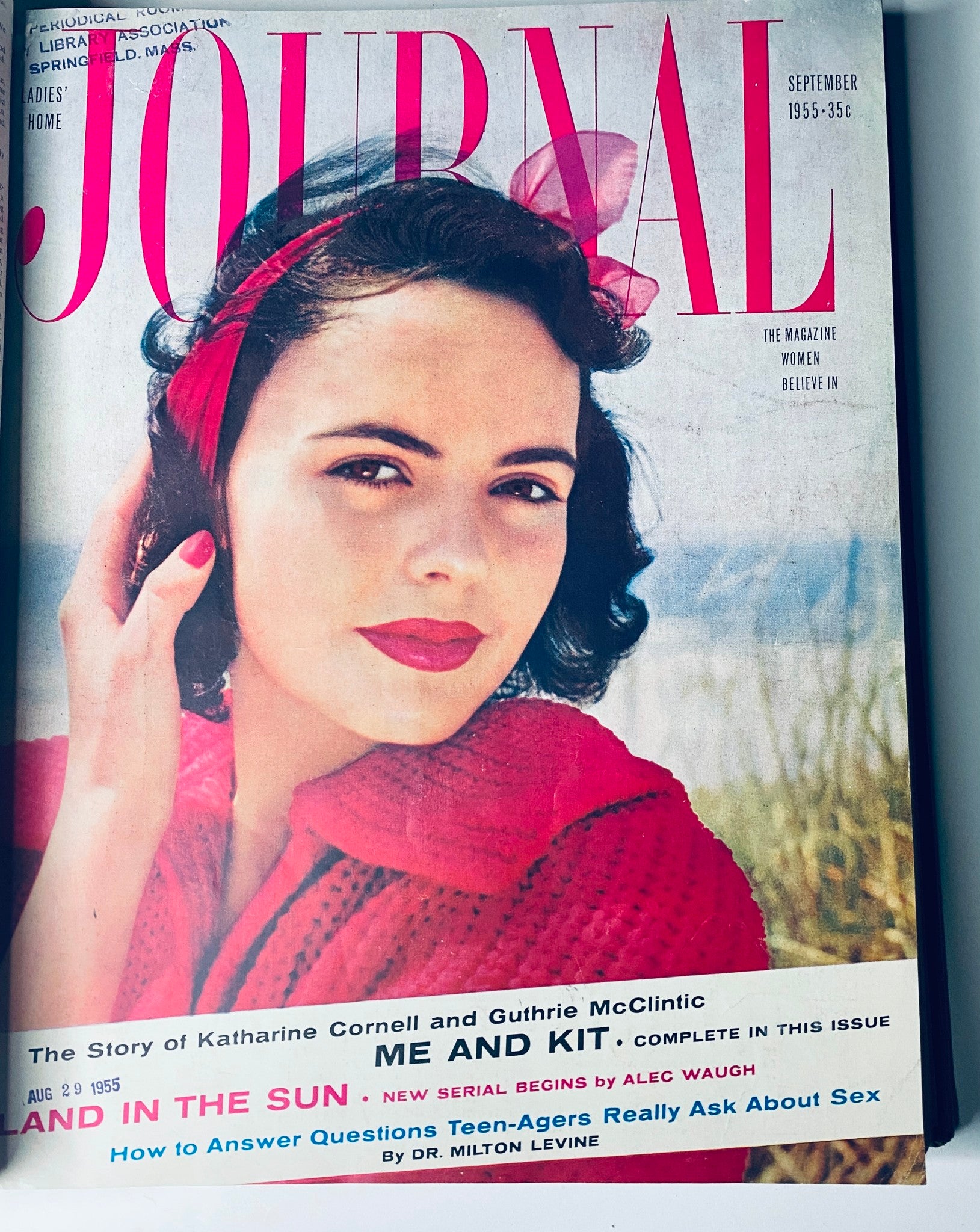 Cover of Ladies' Home Journal September 1955 magazine featuring a woman with red lips and a bow in her dark hair, promoting stories on relationships and advice for teenagers.