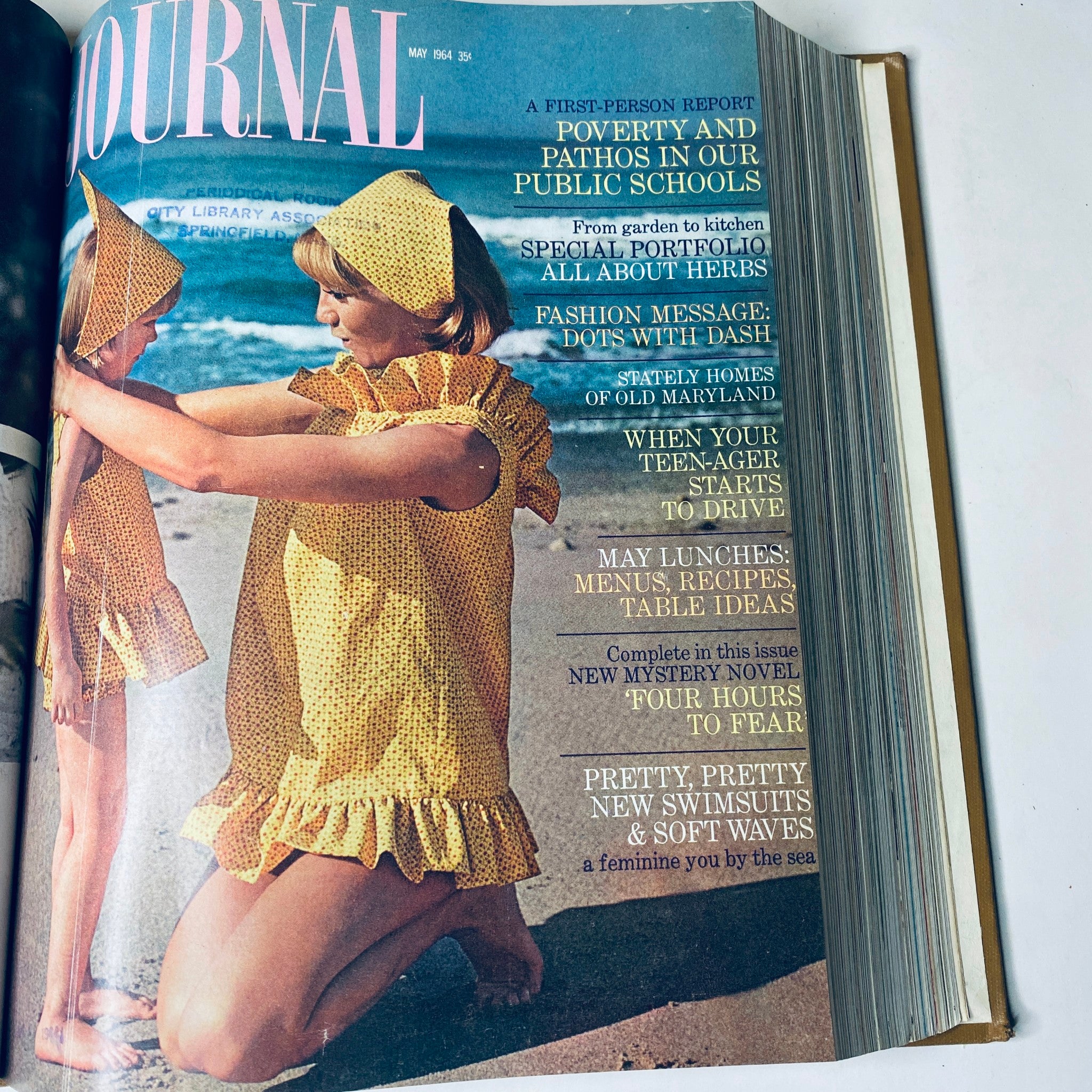 Cover of Ladies' Home Journal May 1964 featuring two girls in matching yellow dresses on the beach, promoting articles about parenting and summer fashion.