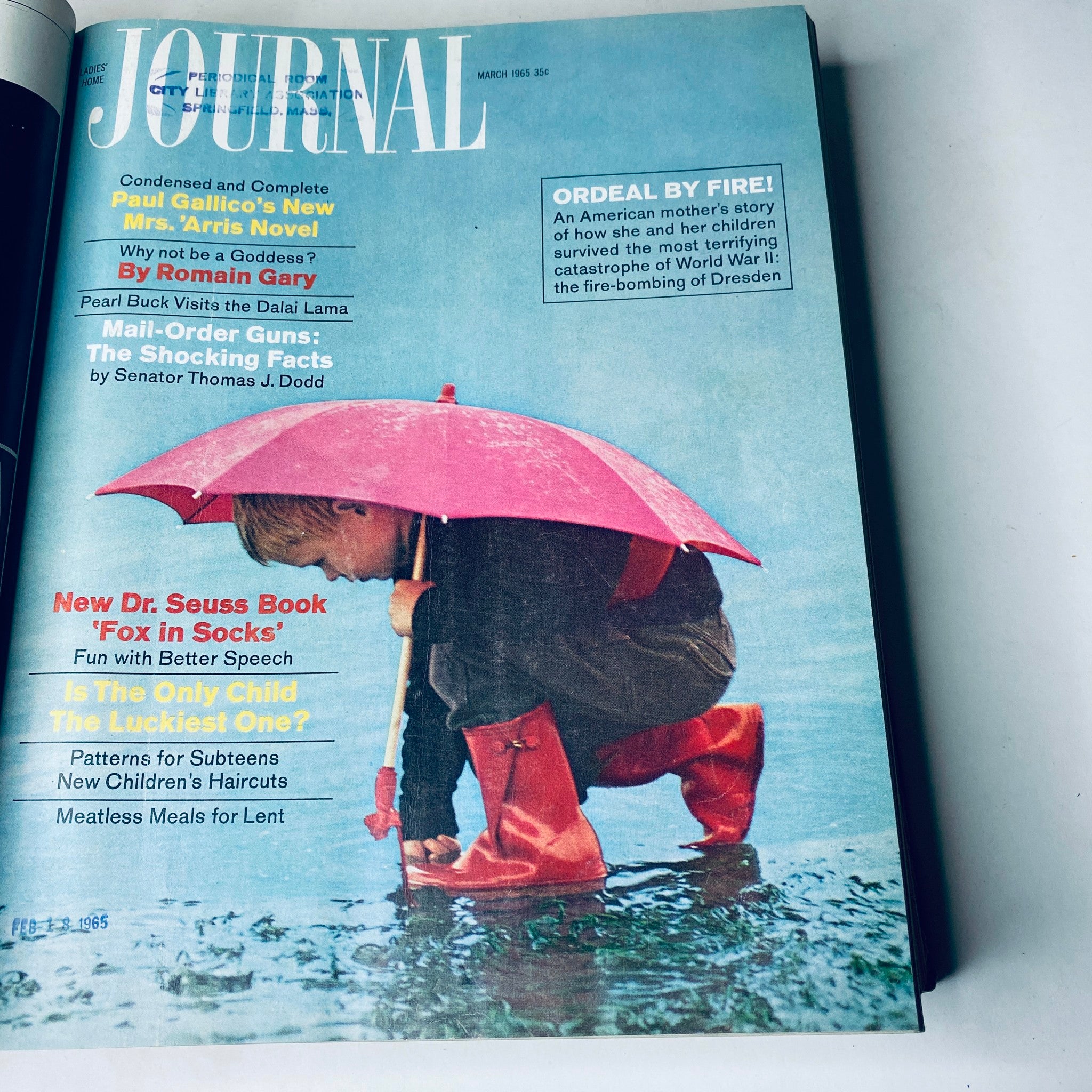 Cover of Ladies' Home Journal March 1965 with a child holding a pink umbrella in the rain, discussing children’s literature and wartime experiences.