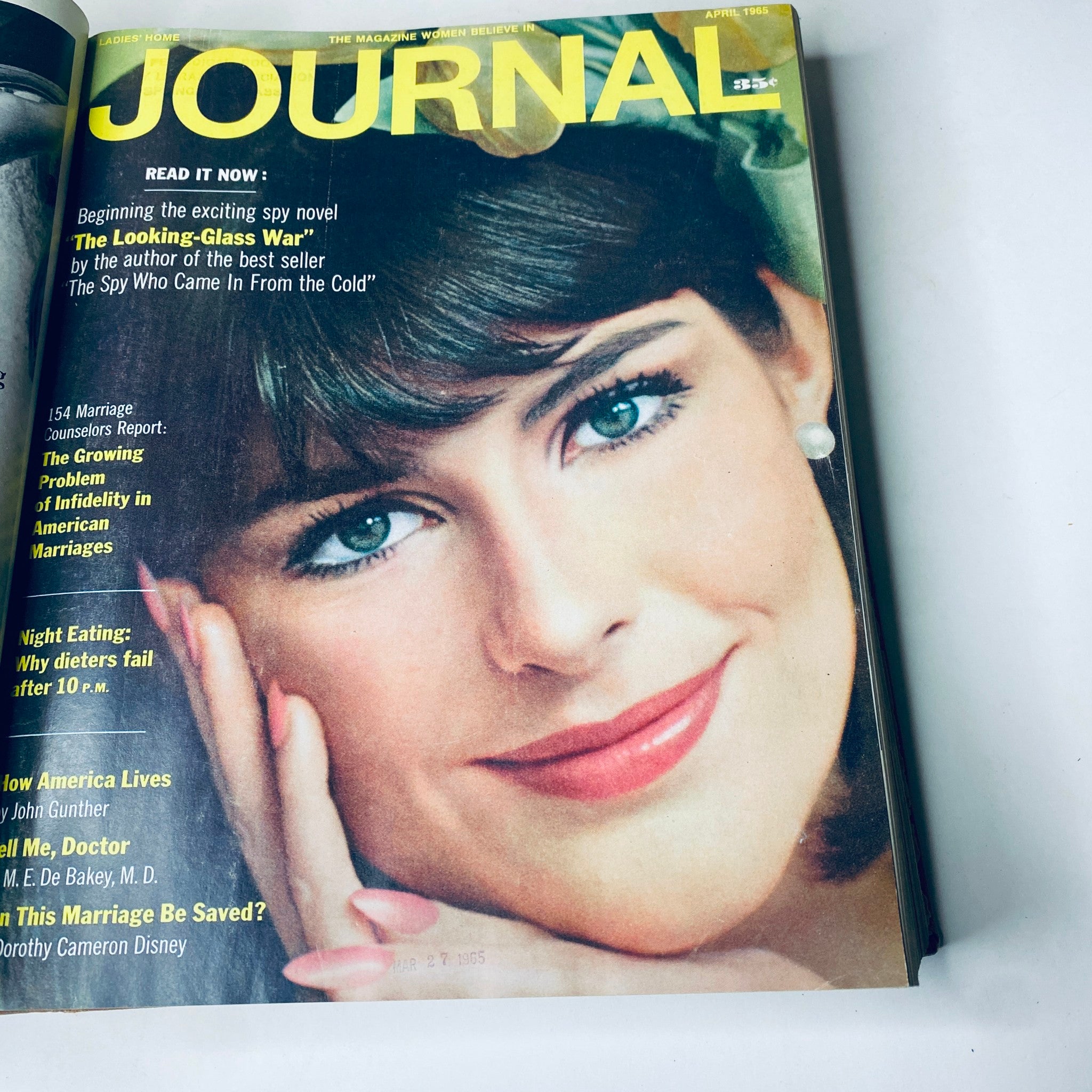 Cover of Ladies' Home Journal April 1965 featuring a woman with striking blue eyes, highlighting articles on marriage and health.