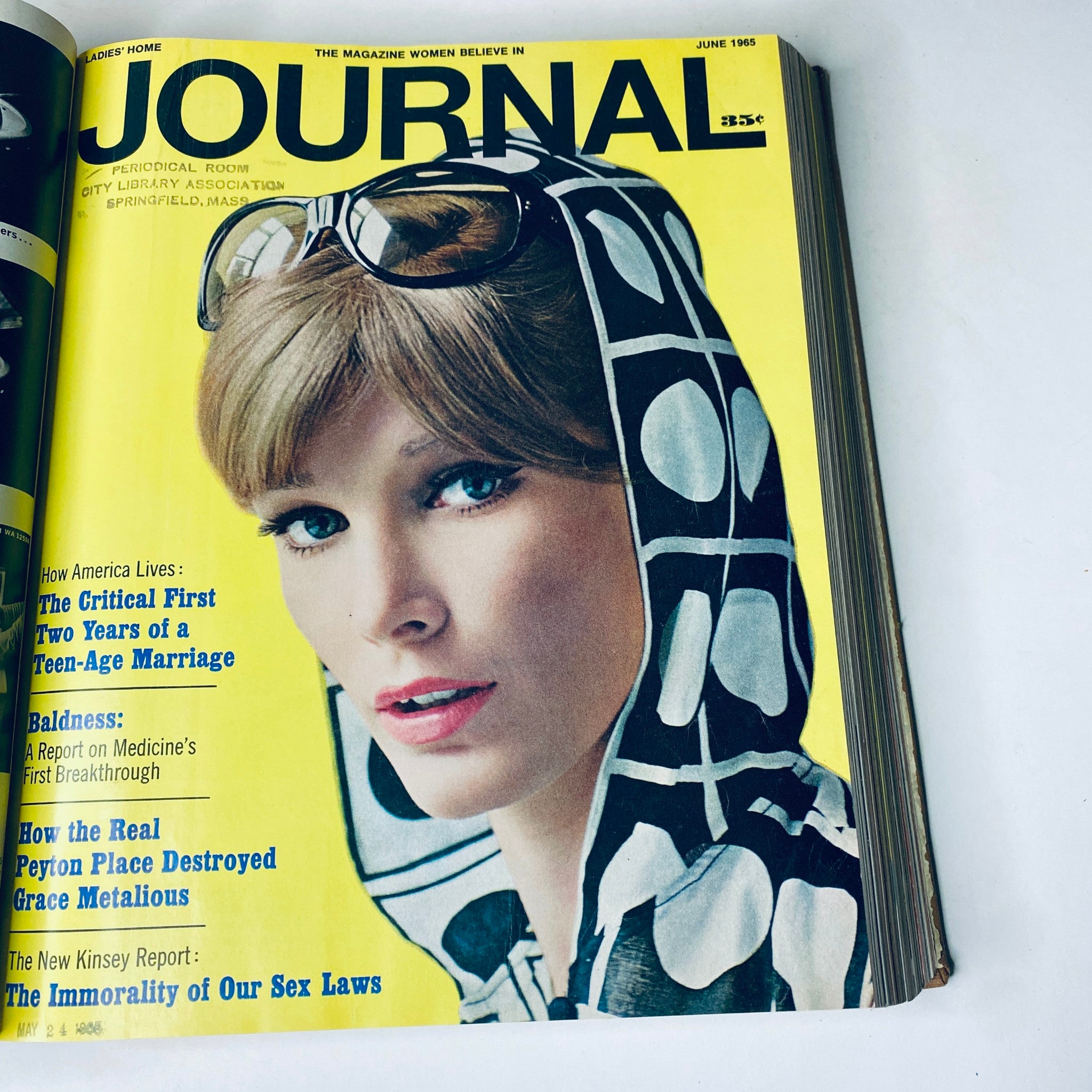 Cover of Ladies' Home Journal June 1965 featuring a model in sunglasses and a patterned scarf, covering topics on new lifestyle trends.