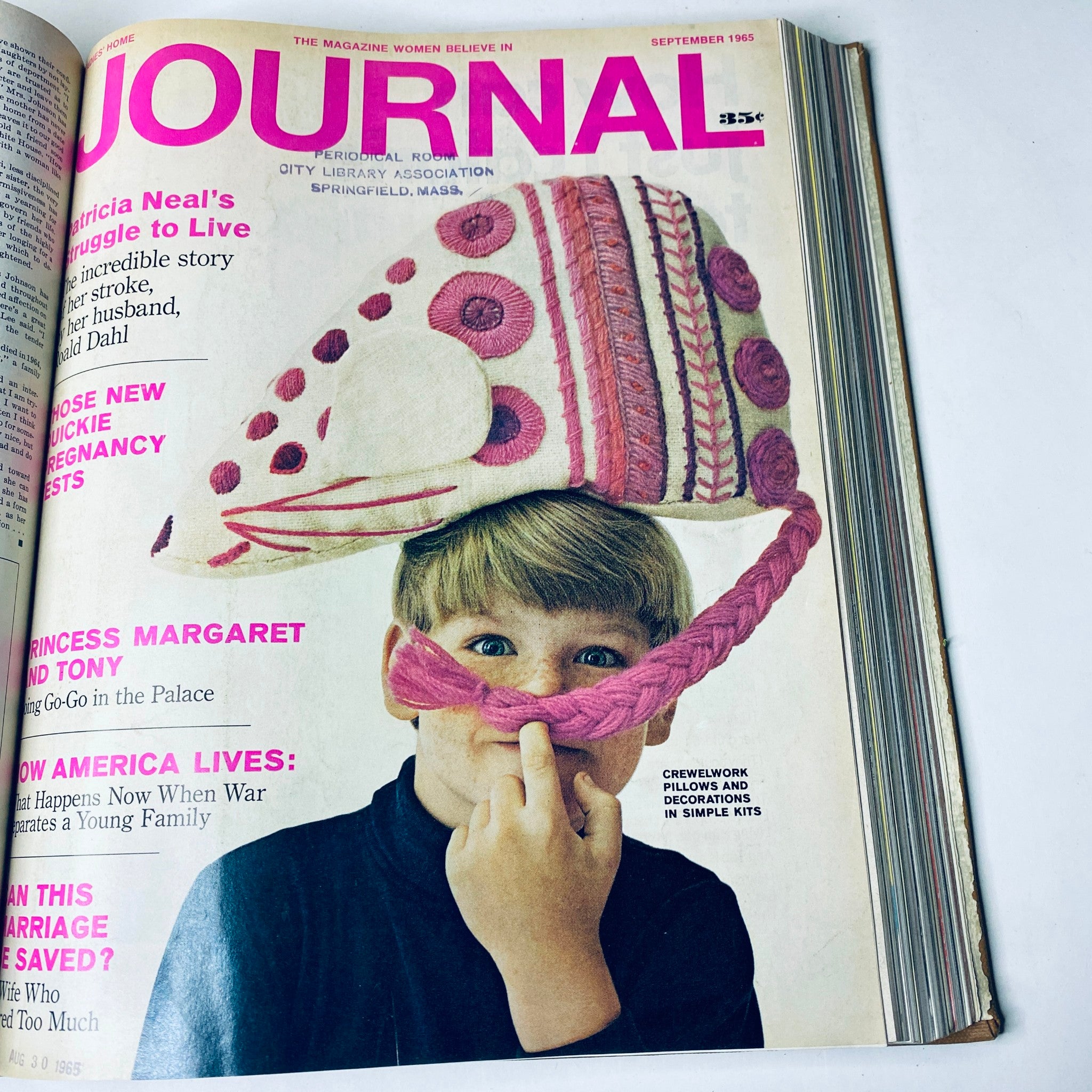 Cover of Ladies' Home Journal from September 1965 depicting a child wearing a playful hat, alongside articles about family life and parenting issues.