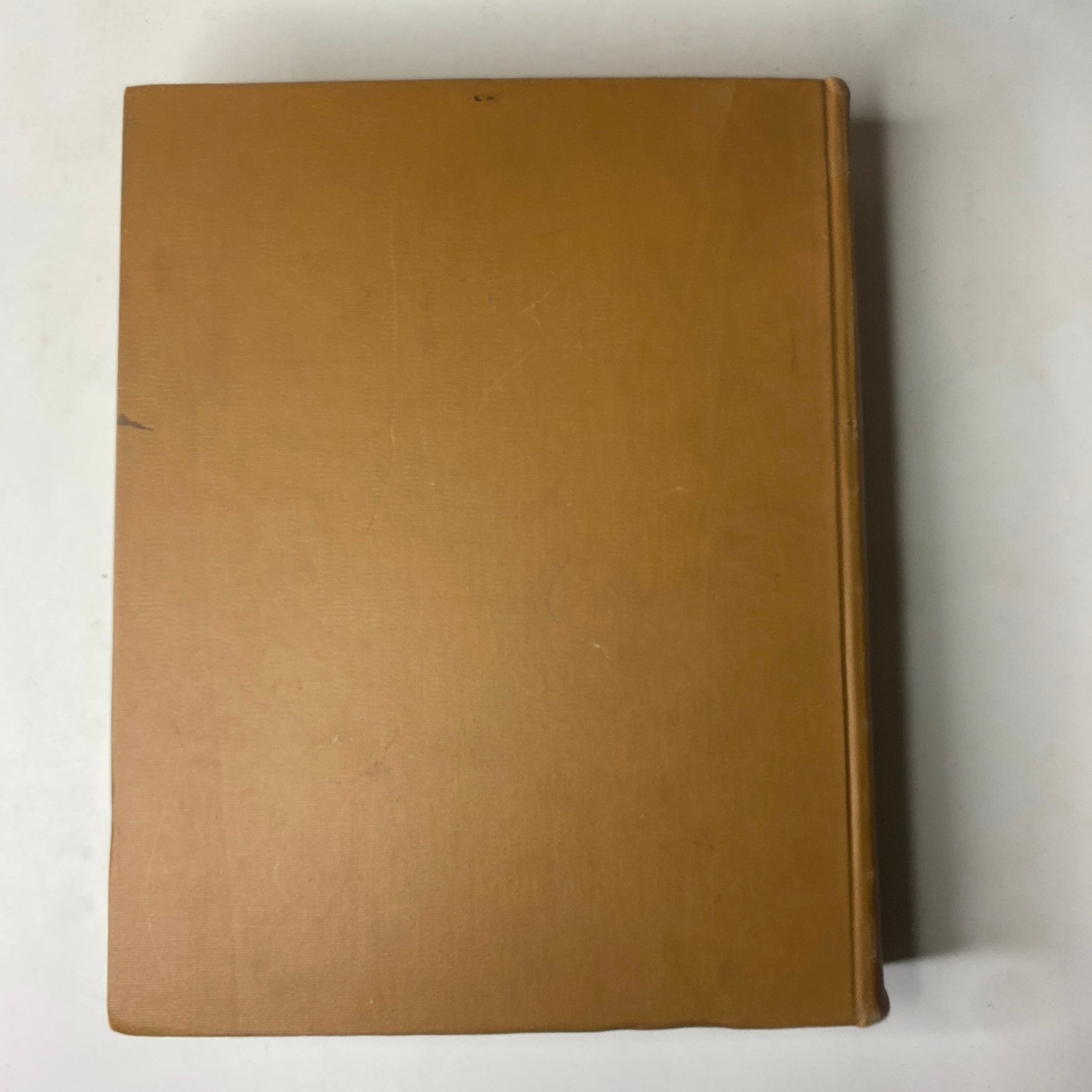 The spine view of the Ladies' Home Journal Bound Magazine 1965, displaying a plain tan cover, highlighting the complete yearly collection from January to December.