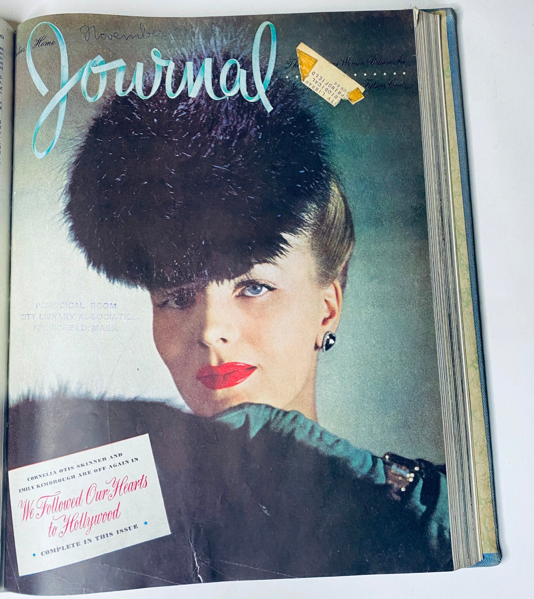 Ladies' Home Journal Library Bound Magazine 1943 with a captivating cover featuring a glamorous woman in a stylish hat and fur accessory for the November issue.