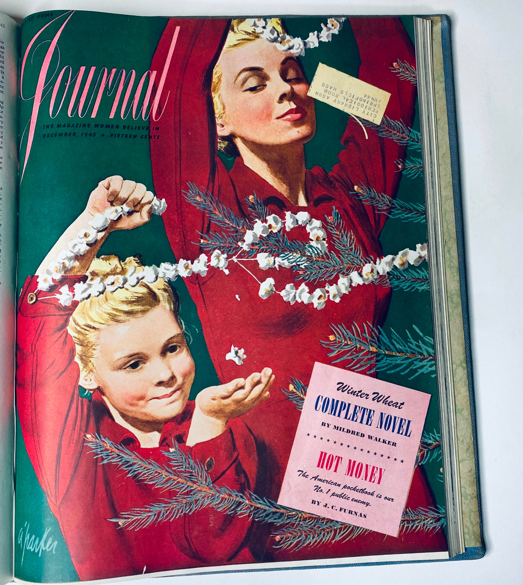 Ladies' Home Journal Library Bound Magazine 1943 showcasing a festive December cover with two women celebrating the holiday season, decorated with pine branches.