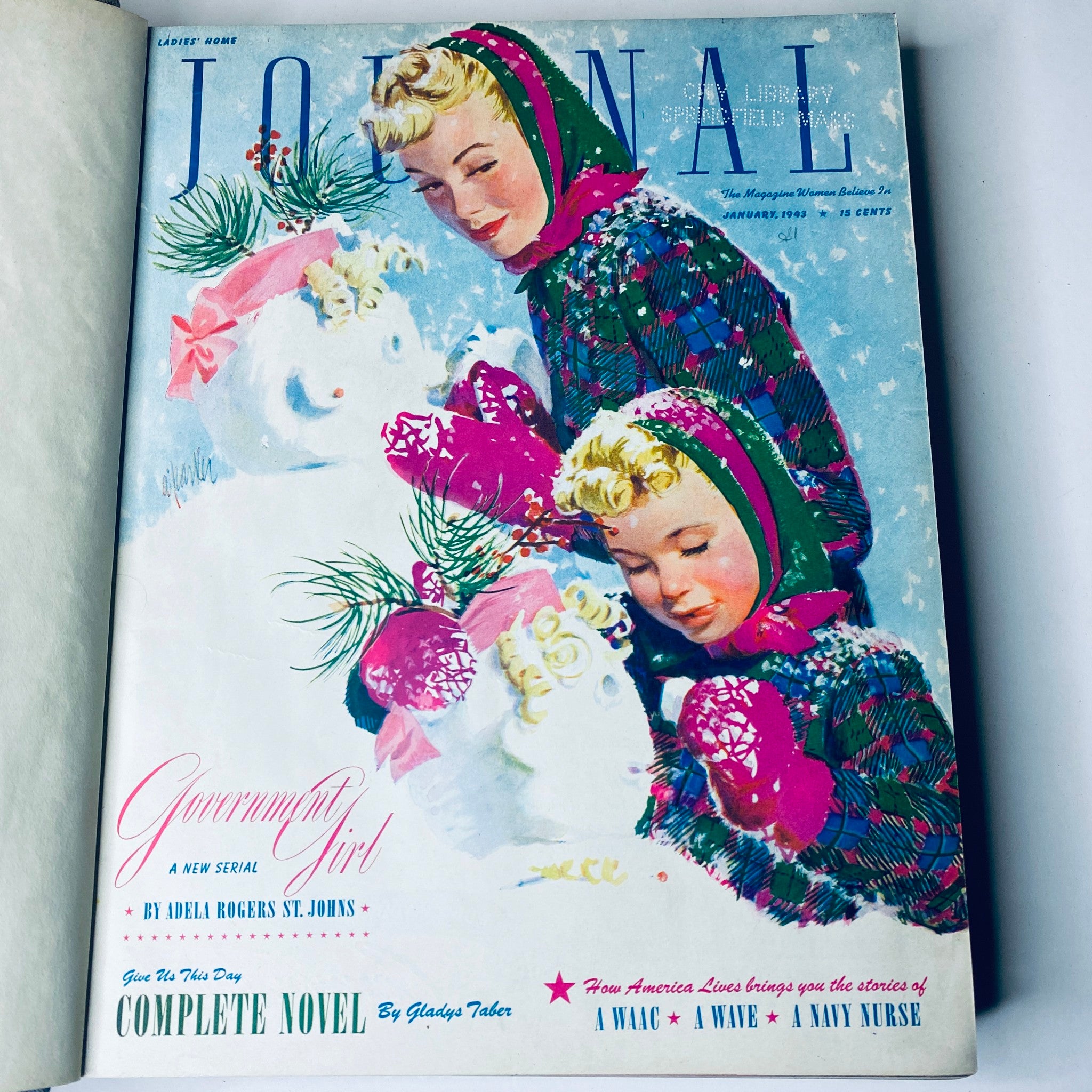 Ladies' Home Journal Library Bound Magazine 1943 featuring a visually appealing January cover depicting two girls building a snowman in winter attire.