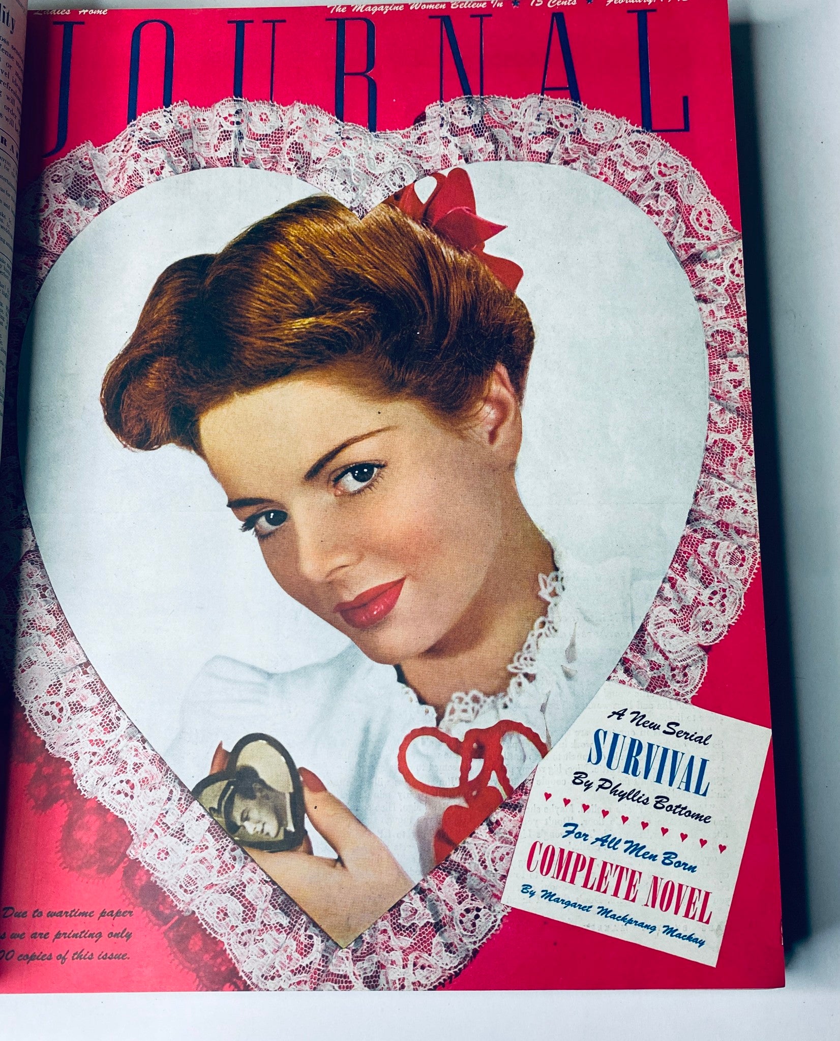 Ladies' Home Journal Library Bound Magazine 1943 with a vibrant February cover showing a woman in a heart-shaped frame, themed around love and romance.