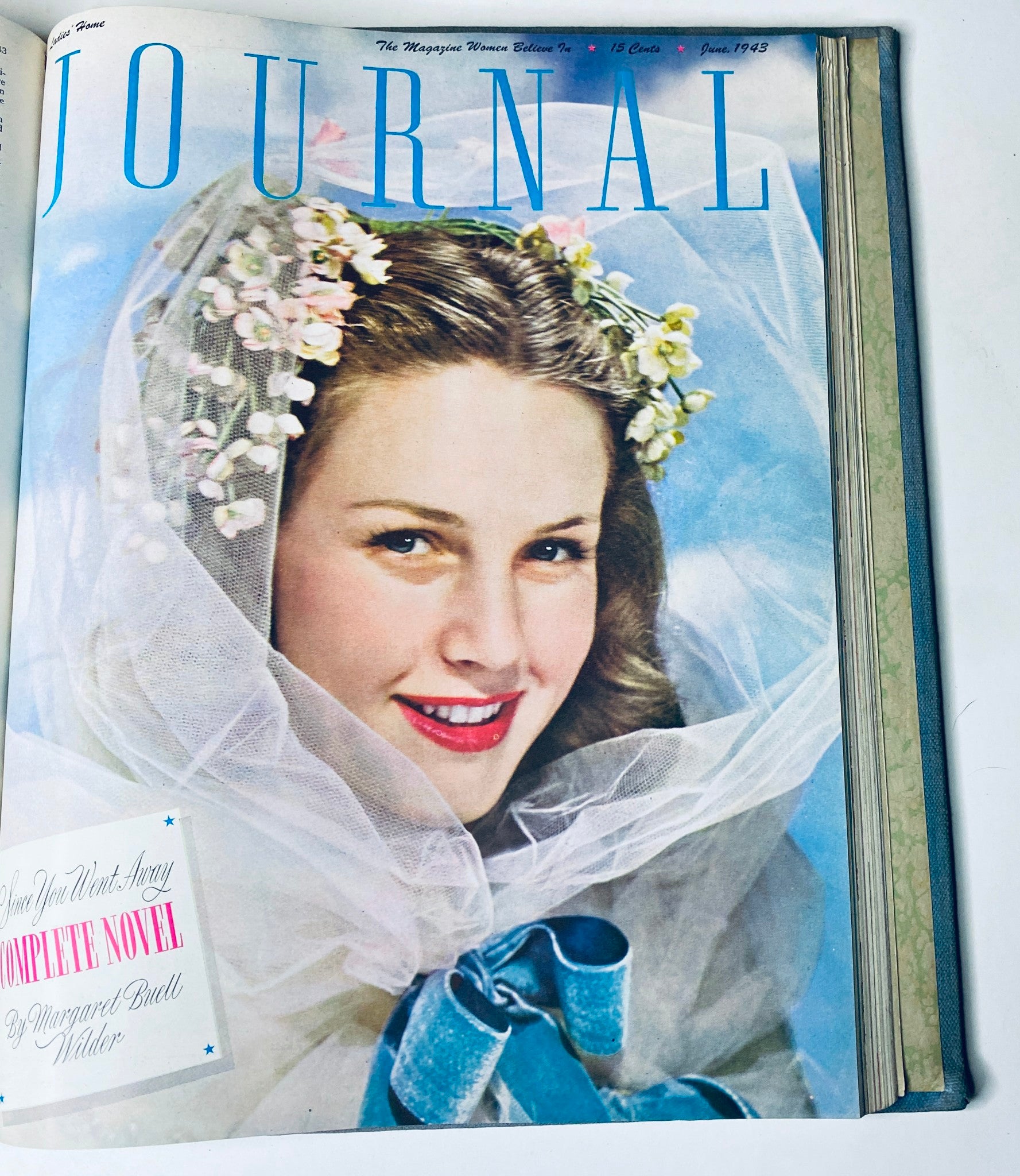Ladies' Home Journal Library Bound Magazine 1943 Full Year January - December, June 1943 cover depicting a woman in a veil with flowers and a blue ribbon.
