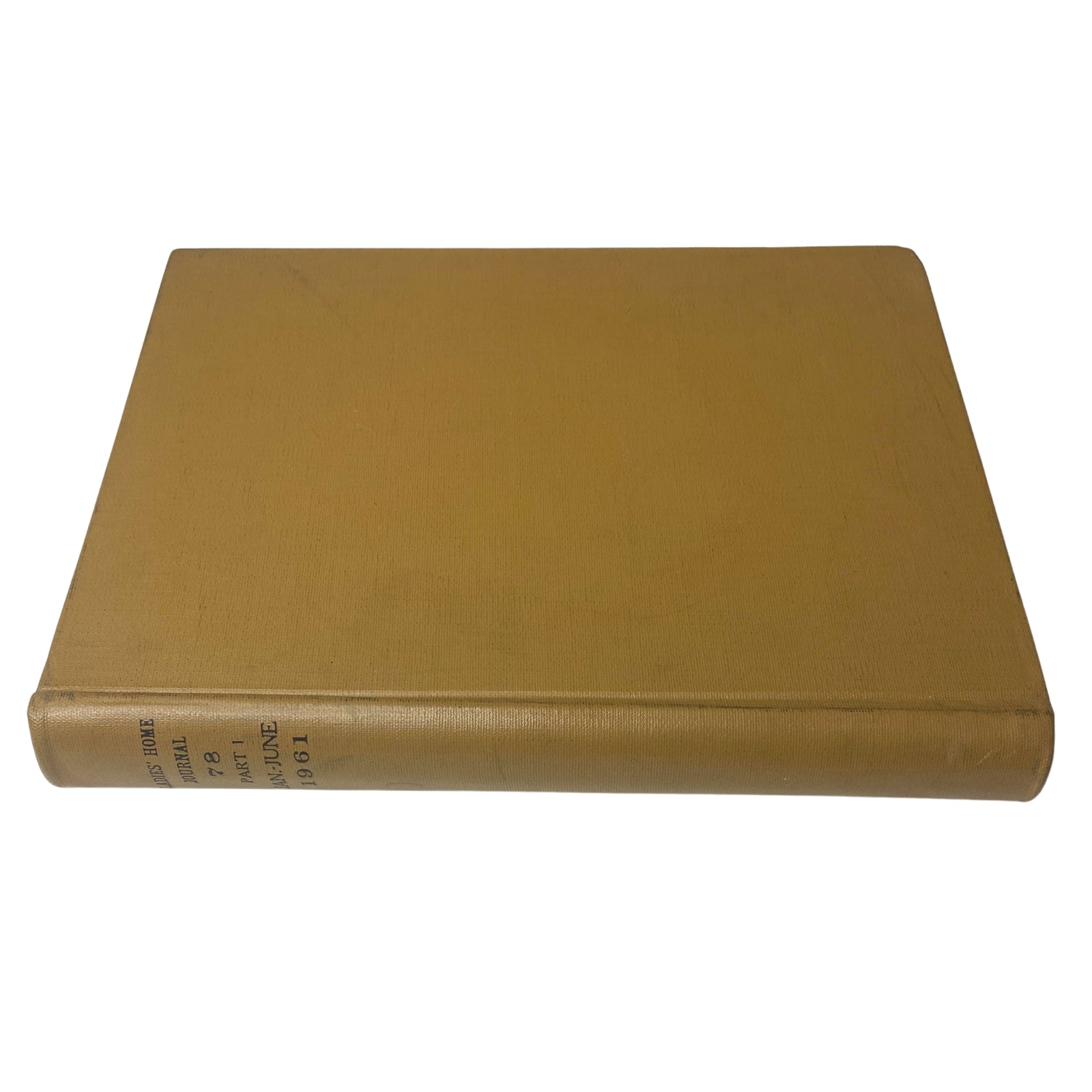 Front view of the Ladies' Home Journal library bound magazine from 1961, highlighting the solid golden cover with no design elements.