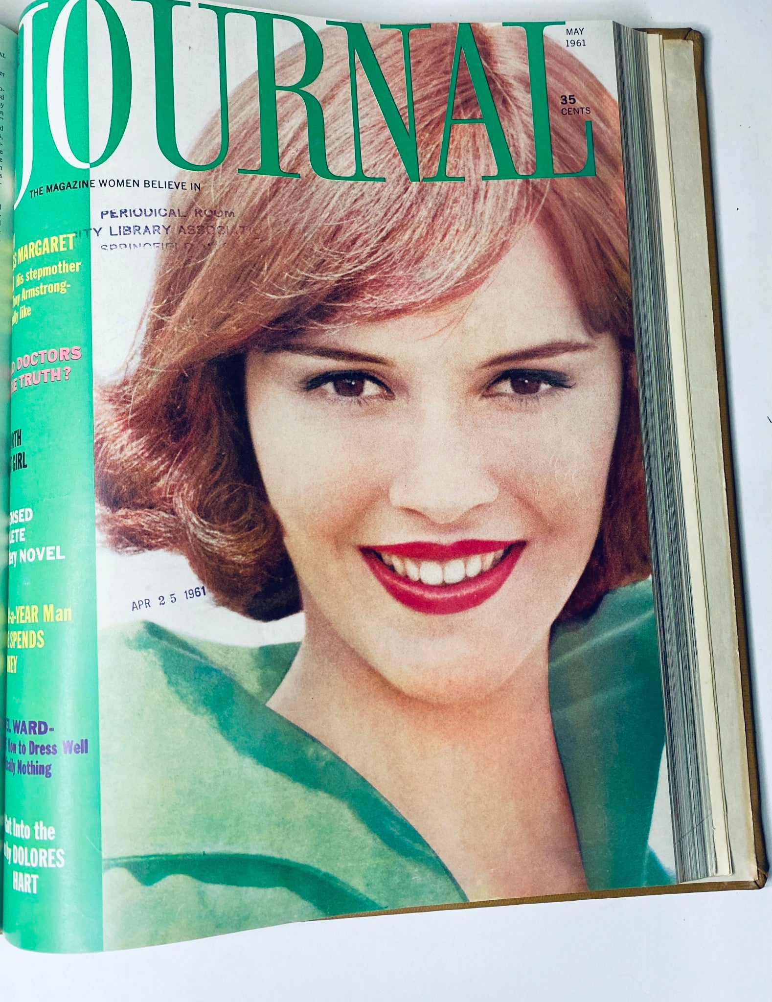 Cover of Ladies' Home Journal Bound Magazine 1961, a bright May edition featuring a smiling woman in green attire, discussing themes of beauty and lifestyle.