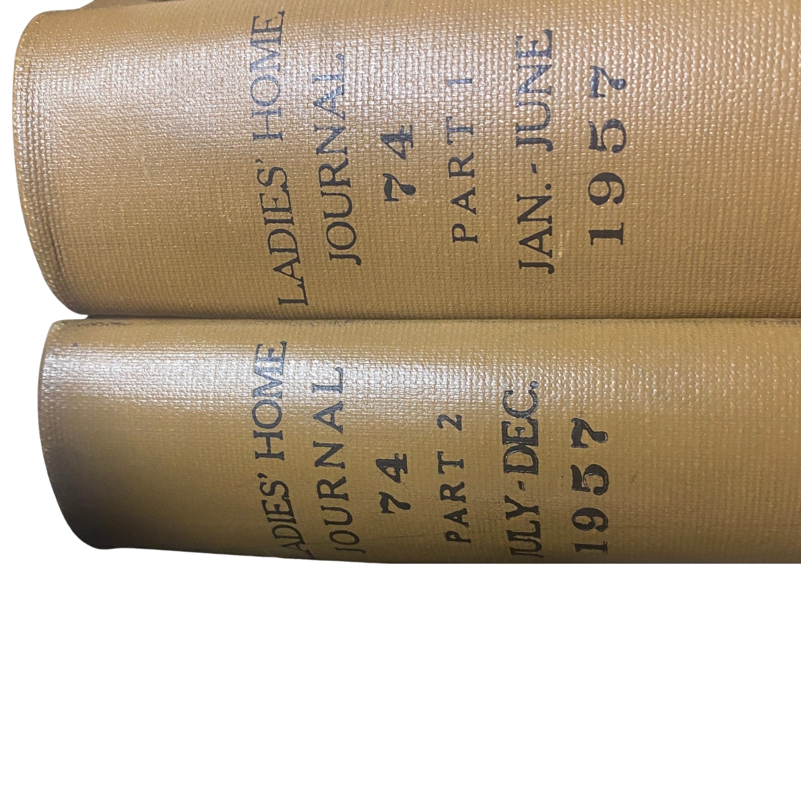 Ladies' Home Journal Library Bound Magazine 1957 Full Year January - December displaying the spine titles of both parts one and two.
