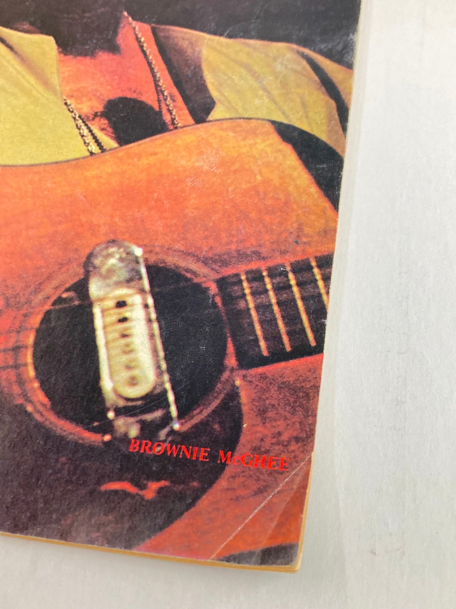 Close-up image of the cover of the VTG Guitar Player Magazine October 1973 featuring Brownie McGhee, showcasing his guitar with visible wear typical for vintage collectibles.