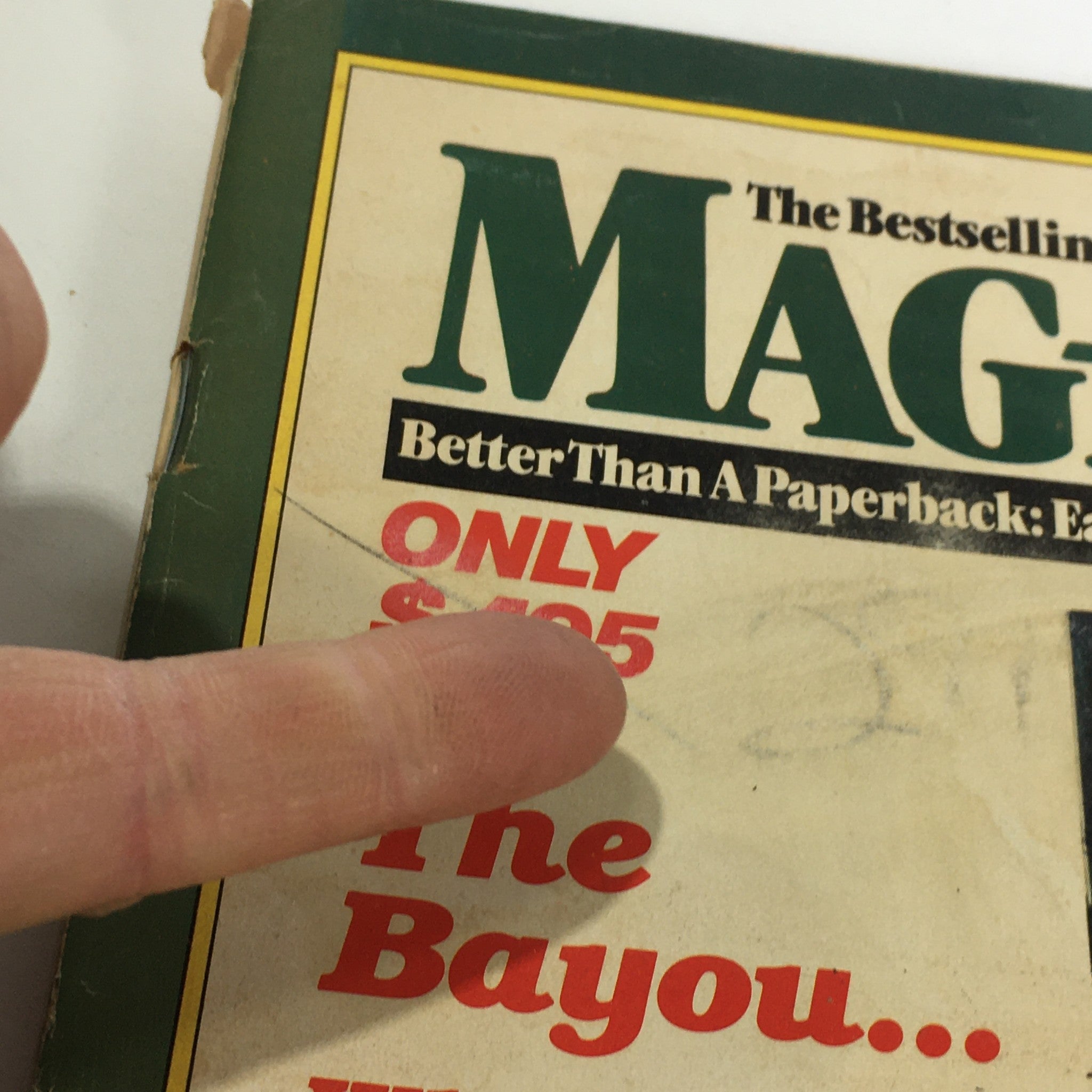 Detailed shot of the upper corner of the VTG Maga-Book Magazine May 1980 Vol. 1 #10, showcasing the magazine's name and promotional text stating it's better than a paperback.