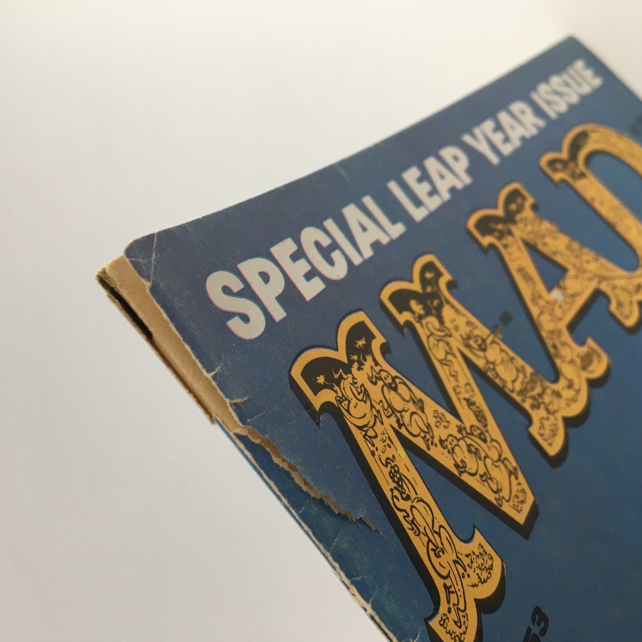 Close-up view of the corner of Mad Magazine March 1960 No. 53 Special Leap Year Issue, showcasing minor wear and tear.