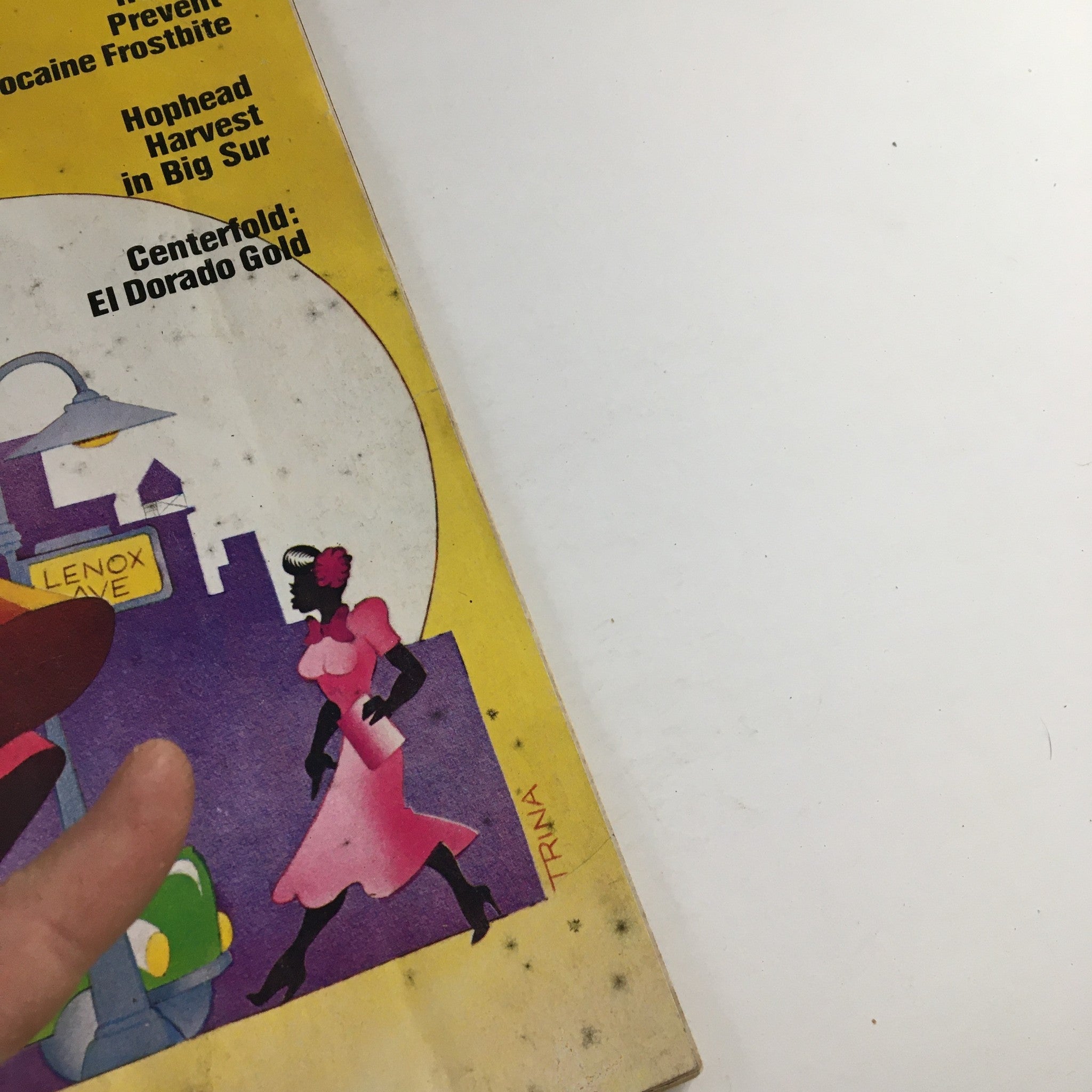 Cover detail of High Times Magazine October 1976 featuring a vintage illustration with a woman in a pink dress and cityscape elements, showcasing the theme of cannabis culture.