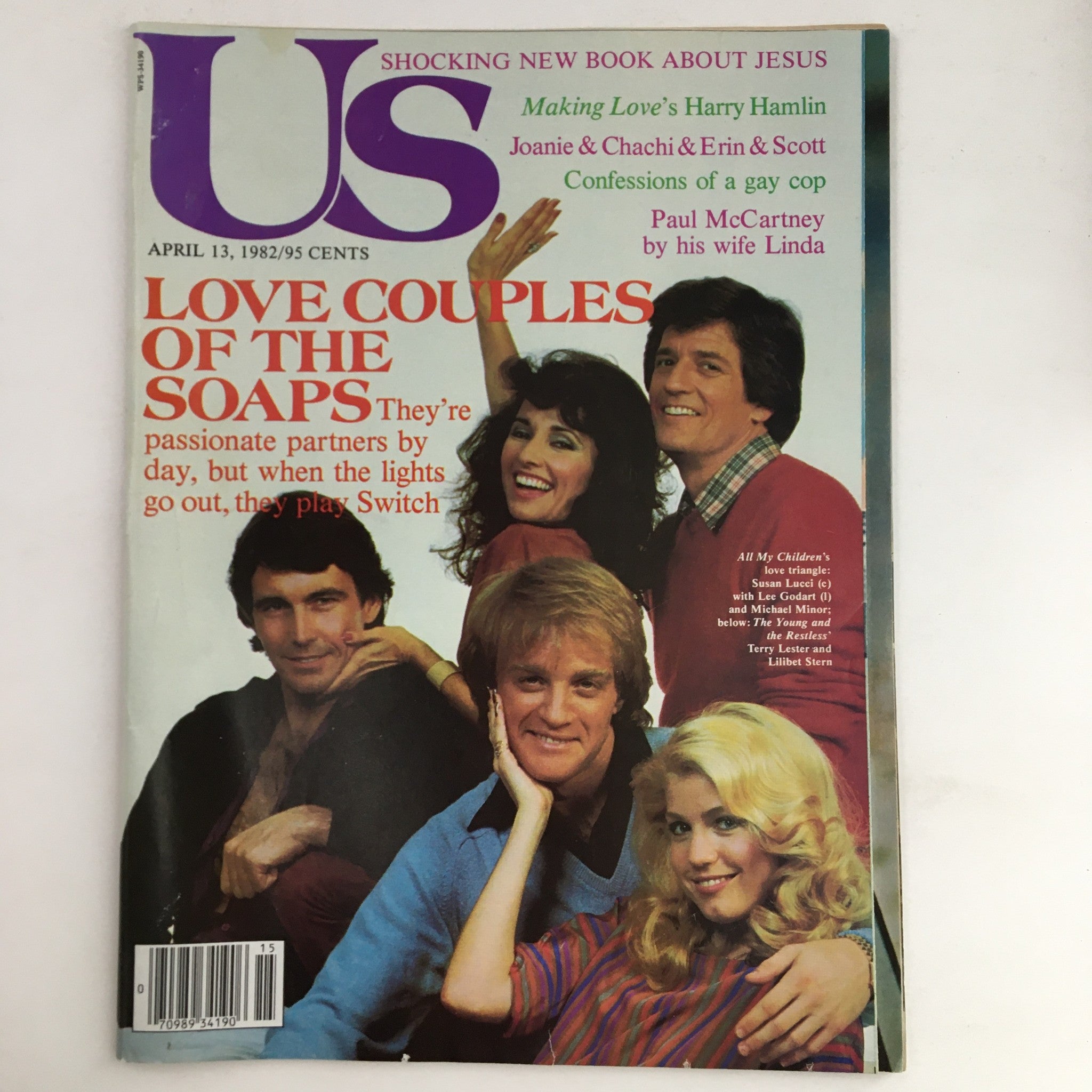 US Magazine cover from April 13, 1982 featuring the title 'LOVE COUPLES OF THE SOAPS.' The issue highlights popular soap opera couples, including Susan Lucci, Lee Godart, and Michael Minor, alongside images of these stars engaged in playful poses.