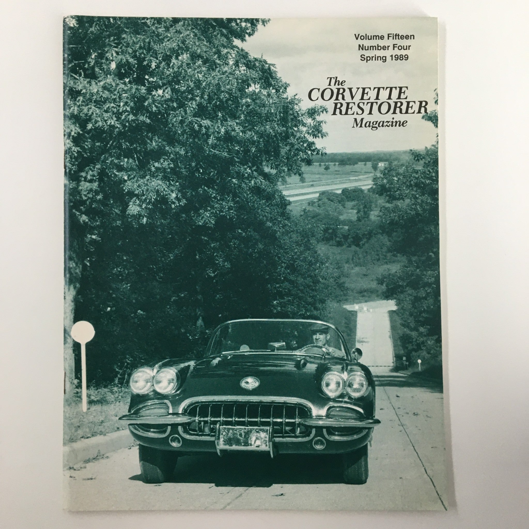 Cover of The Corvette Restorer Magazine Spring 1989 featuring a vintage Corvette along a tree-lined road, highlighting the new Corvette ZR-1.