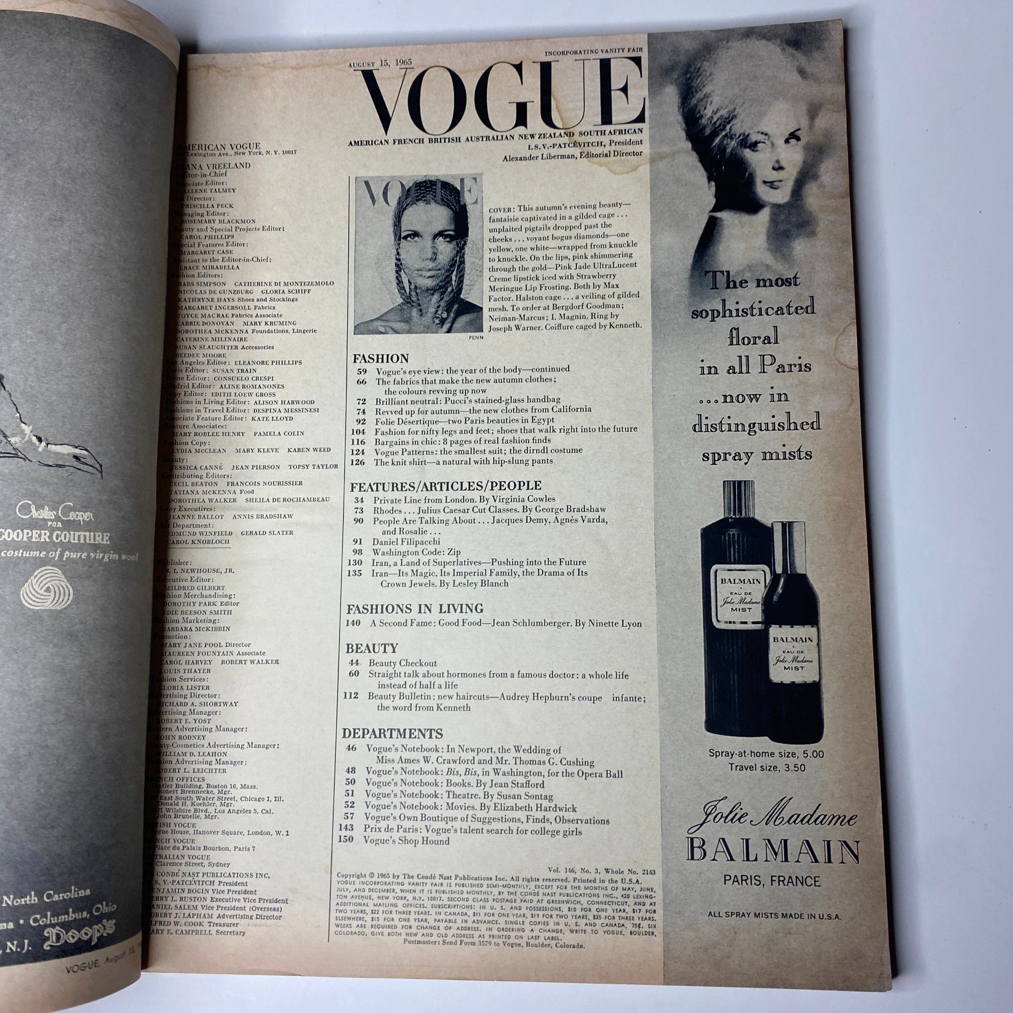 Inside page of Vogue Magazine August 15, 1965, highlighting fashion articles and makeup trends, with an advertisement for Balmain Jolie Madame floral fragrances.