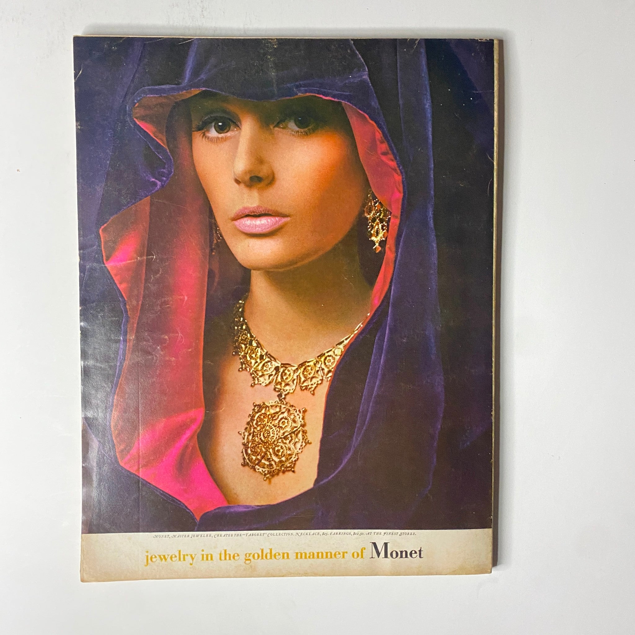 Vogue Magazine September 15, 1967 back cover featuring a striking image of a model wearing jewelry styled in a dramatic hood, showcasing fashion trends from the era.
