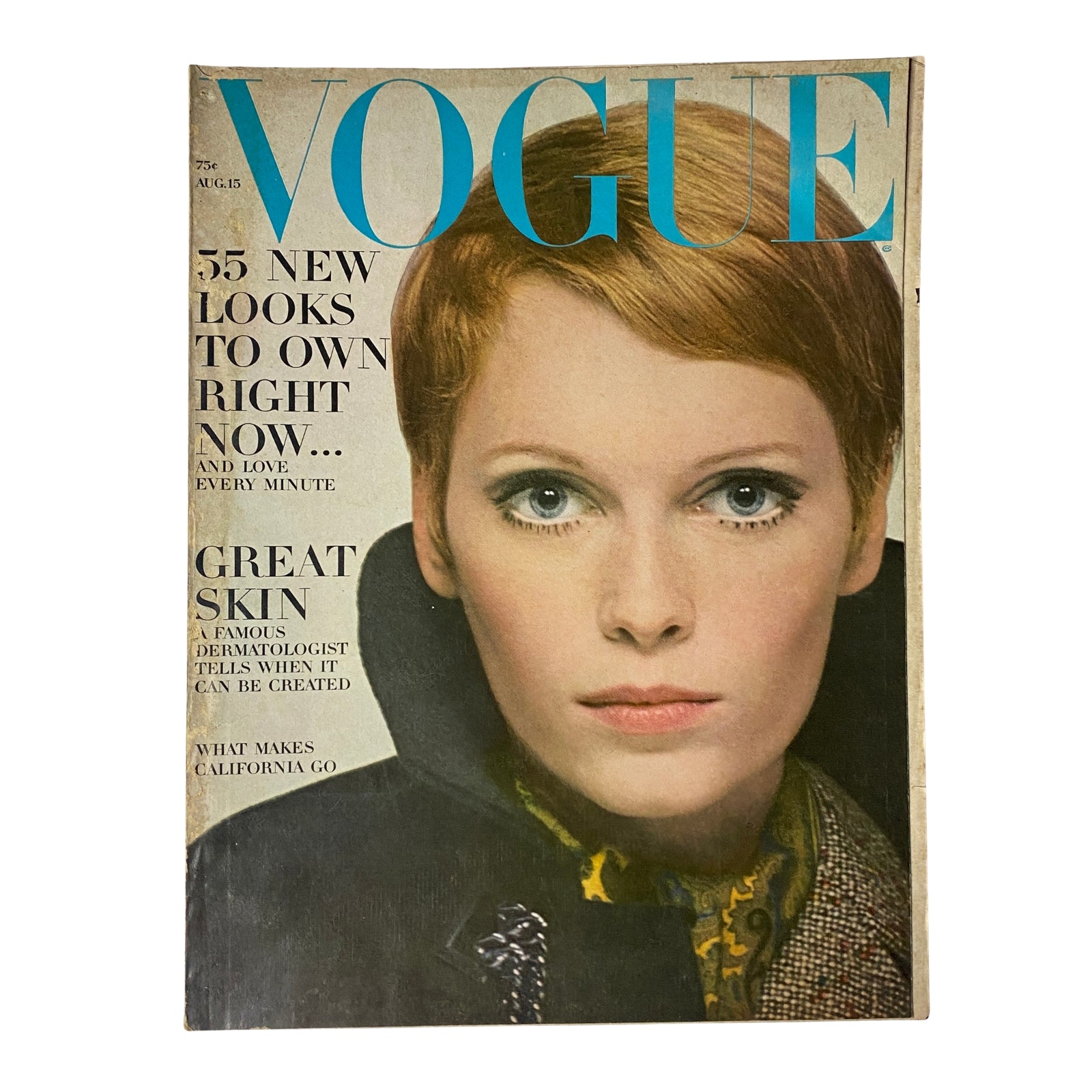 Cover of Vogue Magazine August 15, 1967 featuring actress Mia Farrow in a sleek black velvet wrap dress by Norman Norell, showcasing mid-1960s fashion and style.