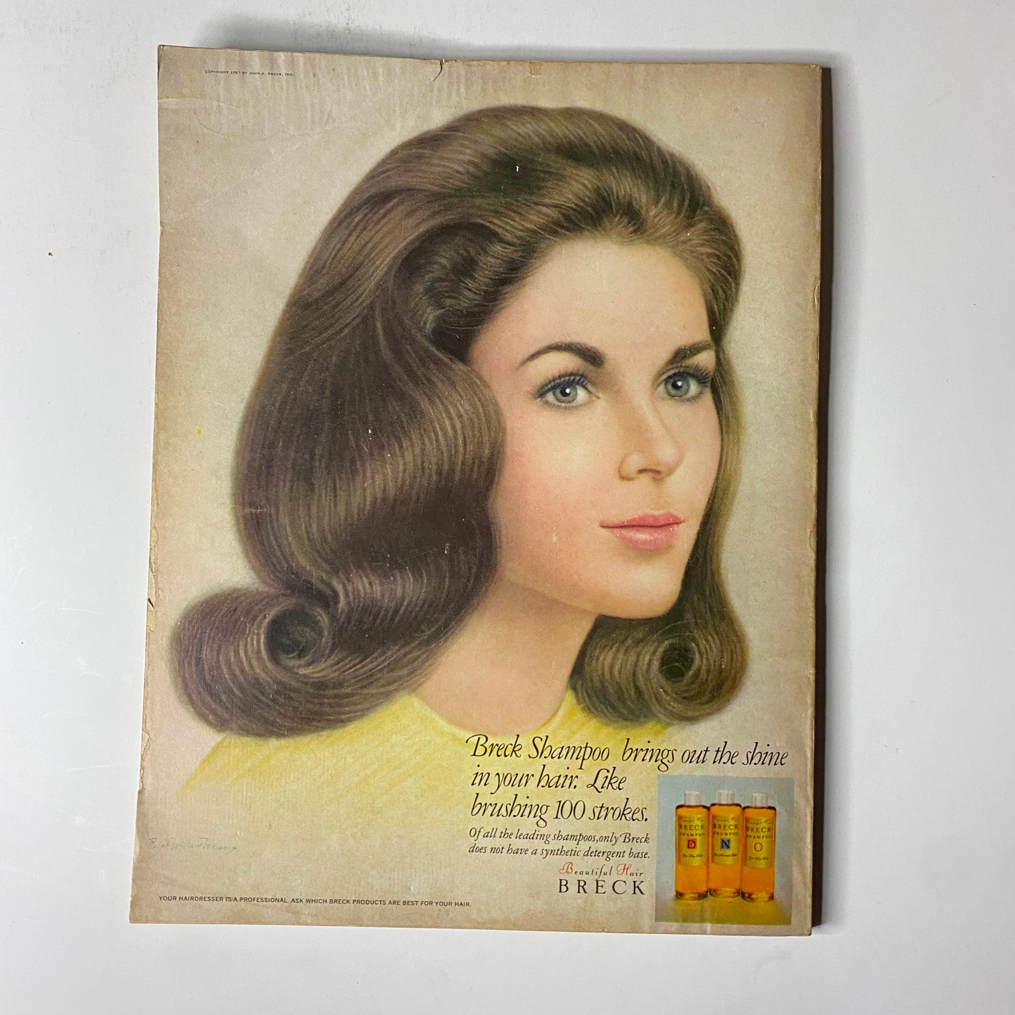 Back cover of Vogue Magazine August 15, 1967 advertising Breck Shampoo with a woman illustrating healthy, shiny hair.