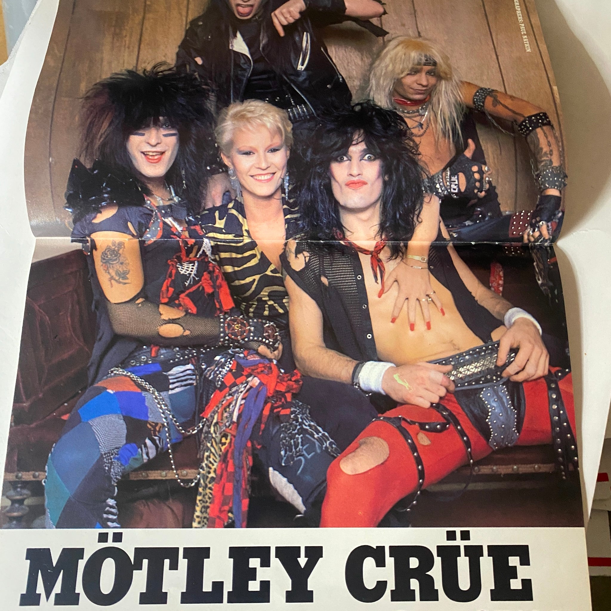 Poster included in VTG Hard Rock Video Magazine September 1986 showcasing the iconic band Mötley Crüe with a vibrant display of 1980s glam rock fashion.