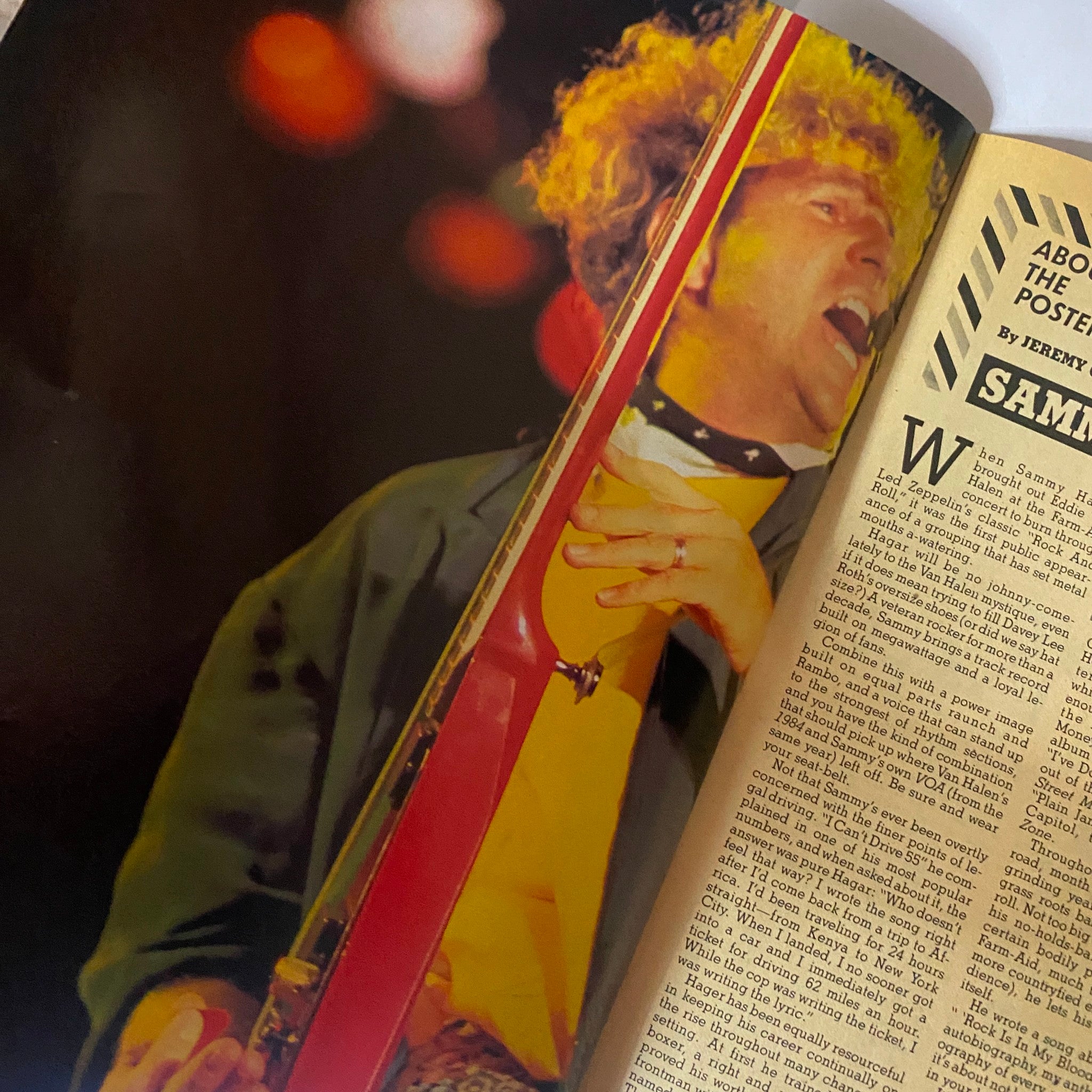 Close-up image from the VTG Hard Rock Video Magazine February 1986 featuring a performer with curly hair during a concert, showcasing the vibrant energy of the 80s hard rock scene.