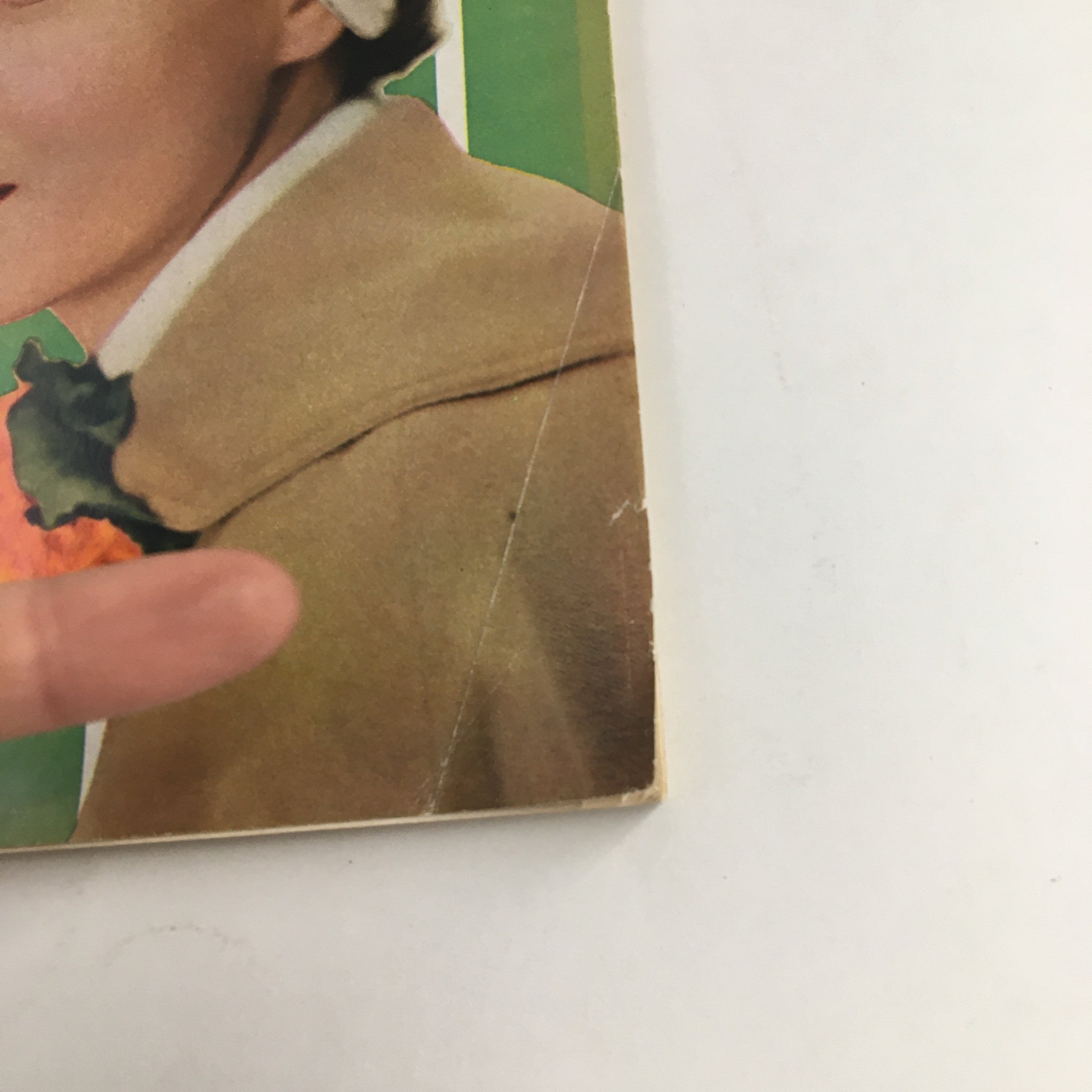 Cover detail of Today's Woman Magazine March 1950, showcasing a woman's portrait with stylish attire and a unique hairstyle.