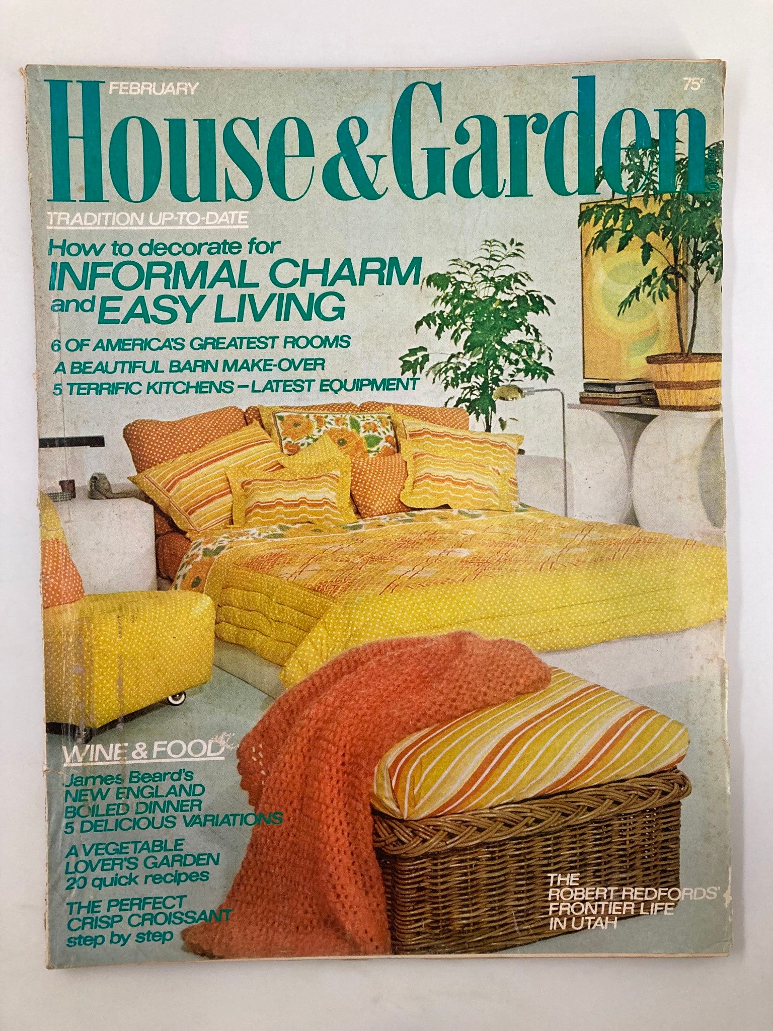 Cover of the February 1974 issue of House & Garden Magazine featuring a vibrant living room setting with yellow and orange cushions, illustrations related to informal charm and easy living, and highlights of James Beard's New England boiled dinner.