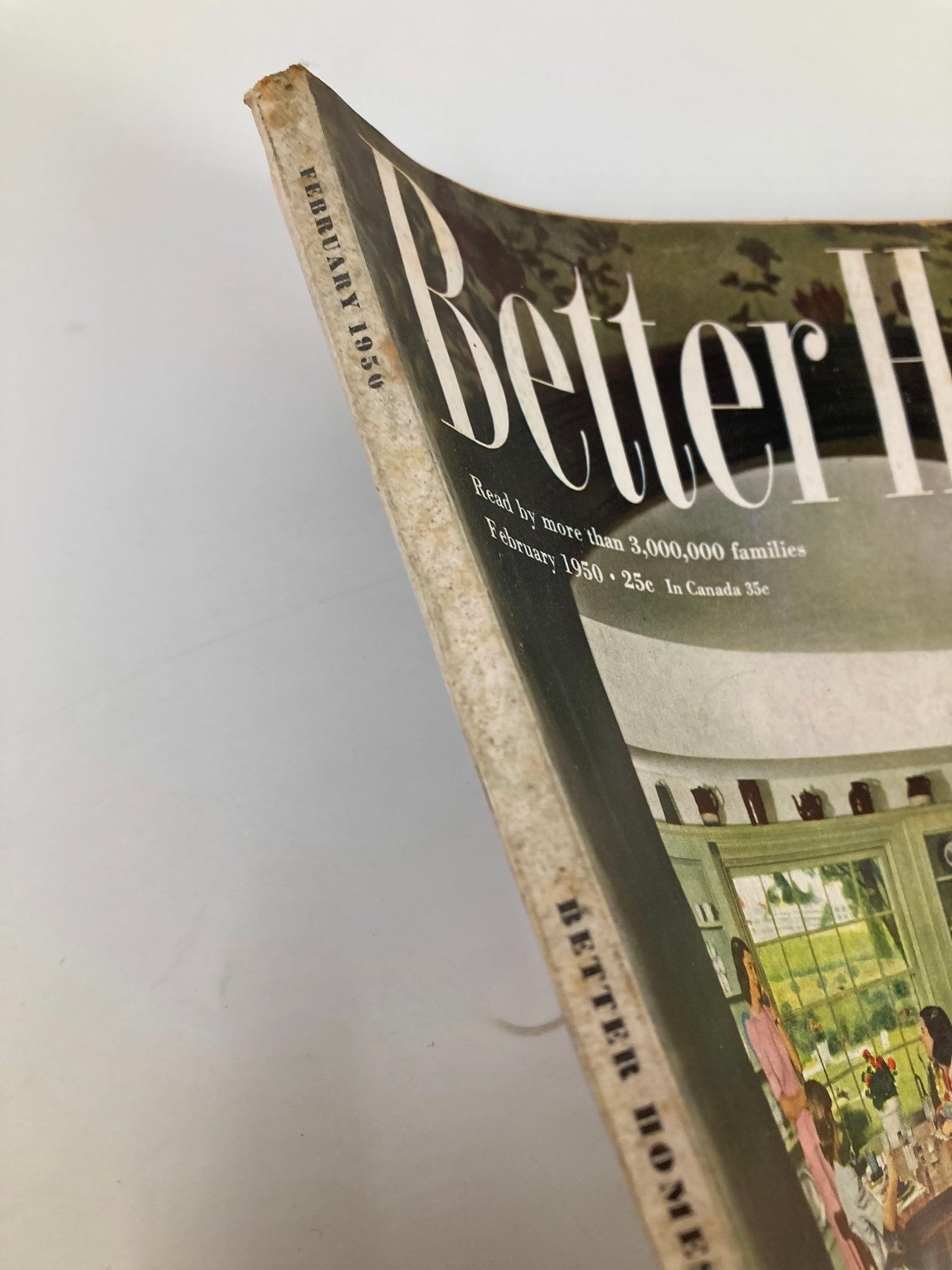 Side view of VTG Better Homes & Garden Magazine February 1950 highlighting the magazine's spine and date, emphasizing its vintage appeal.