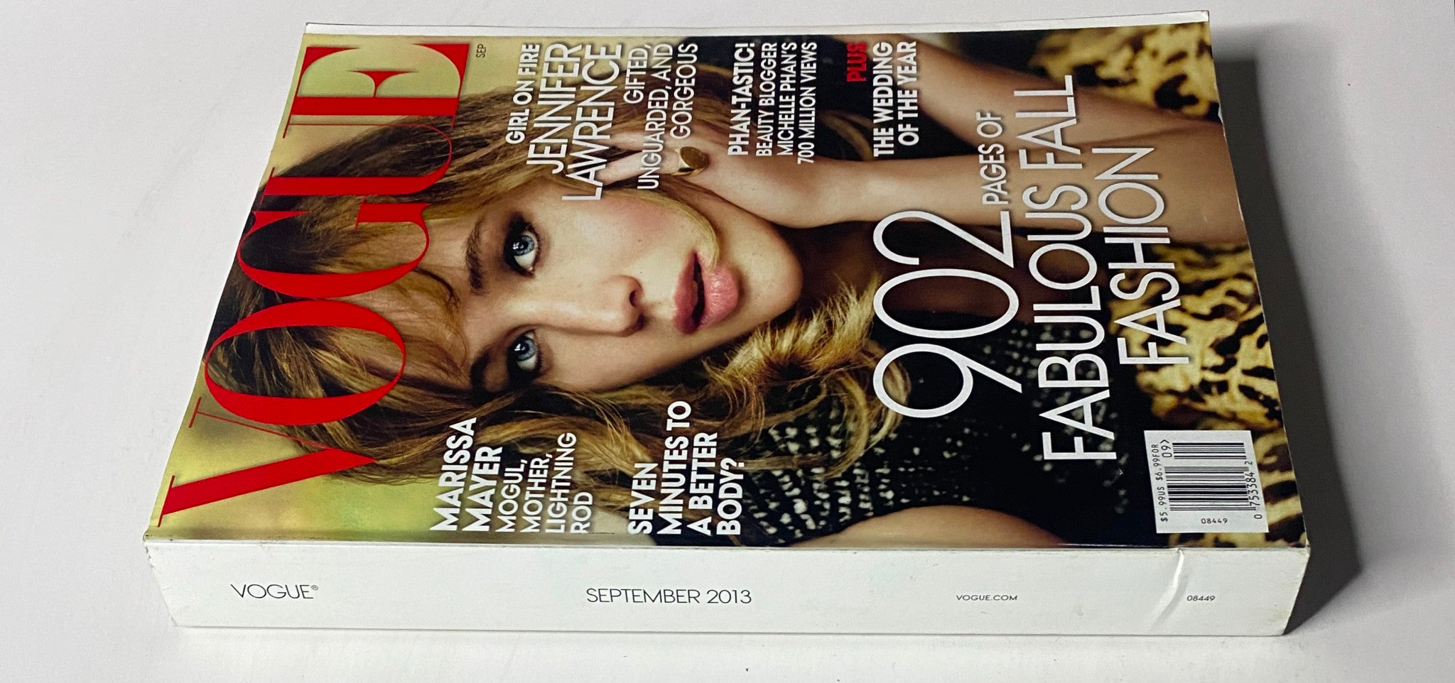 Side view of Vogue Magazine September 2013 showcasing Jennifer Lawrence on the cover, highlighting its notable features and title branding.