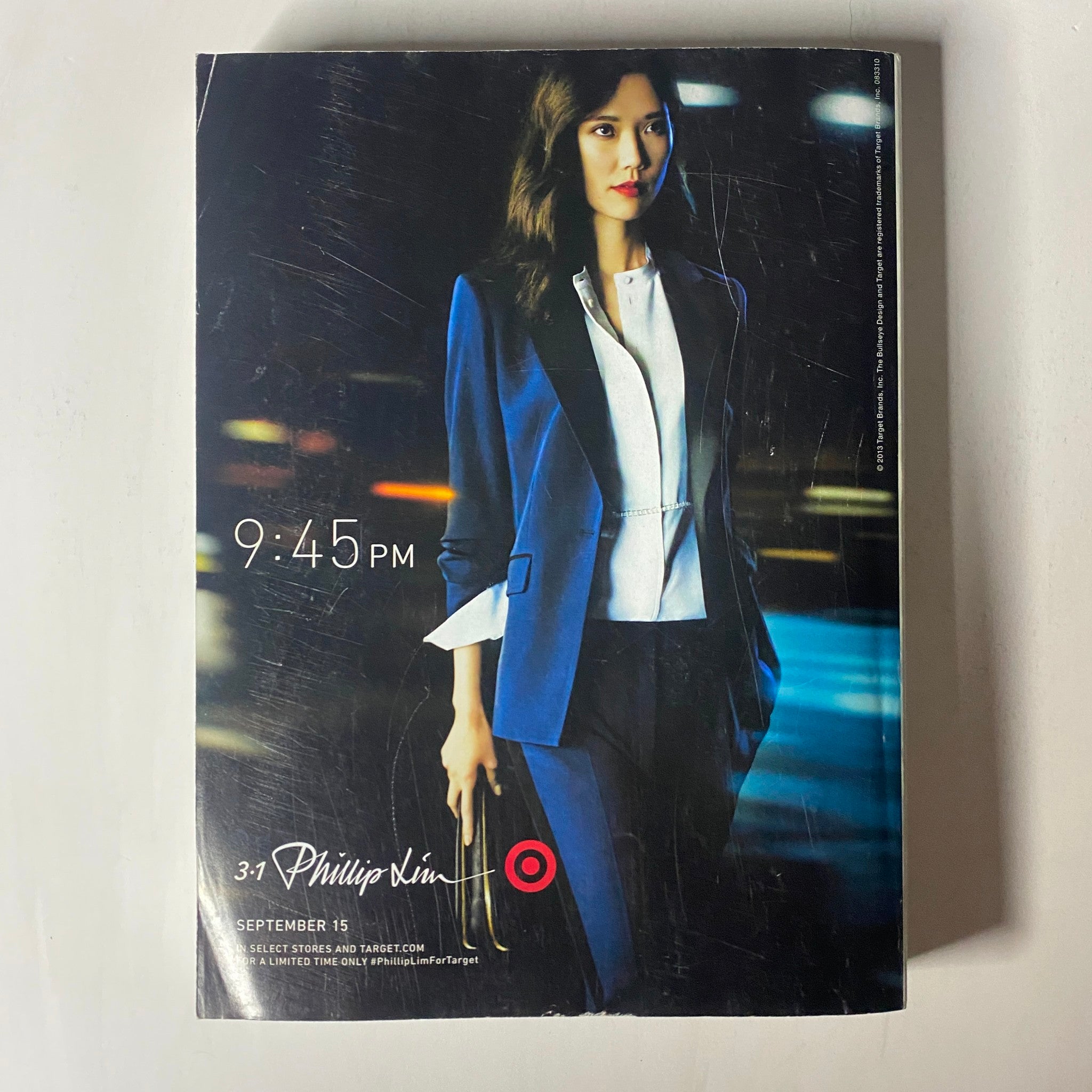 Vogue Magazine September 2013 edition advertisement for Phillip Lim's collection at Target featuring a model in a chic blue suit, promoting the collaboration and style for the season.
