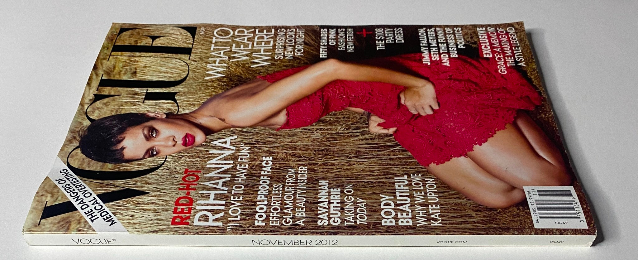 Side view of the Vogue Magazine November 2012 showcasing Rihanna on the cover dressed in a red lace gown, highlighting editorial features and special content.