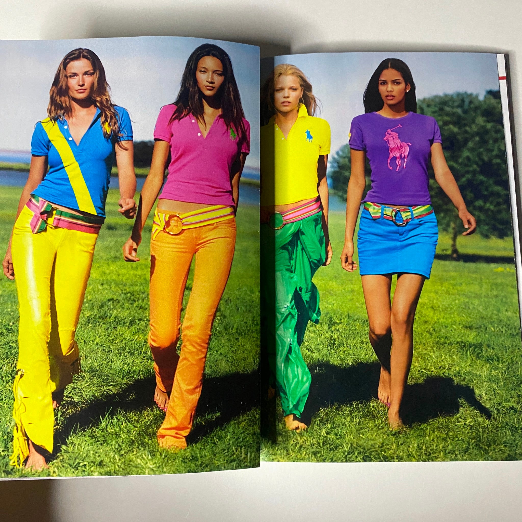 Vogue Magazine May 2012 page displaying models in vibrant outfits showcasing contemporary fashion trends and styles, enhancing the magazine's fashion-forward image.
