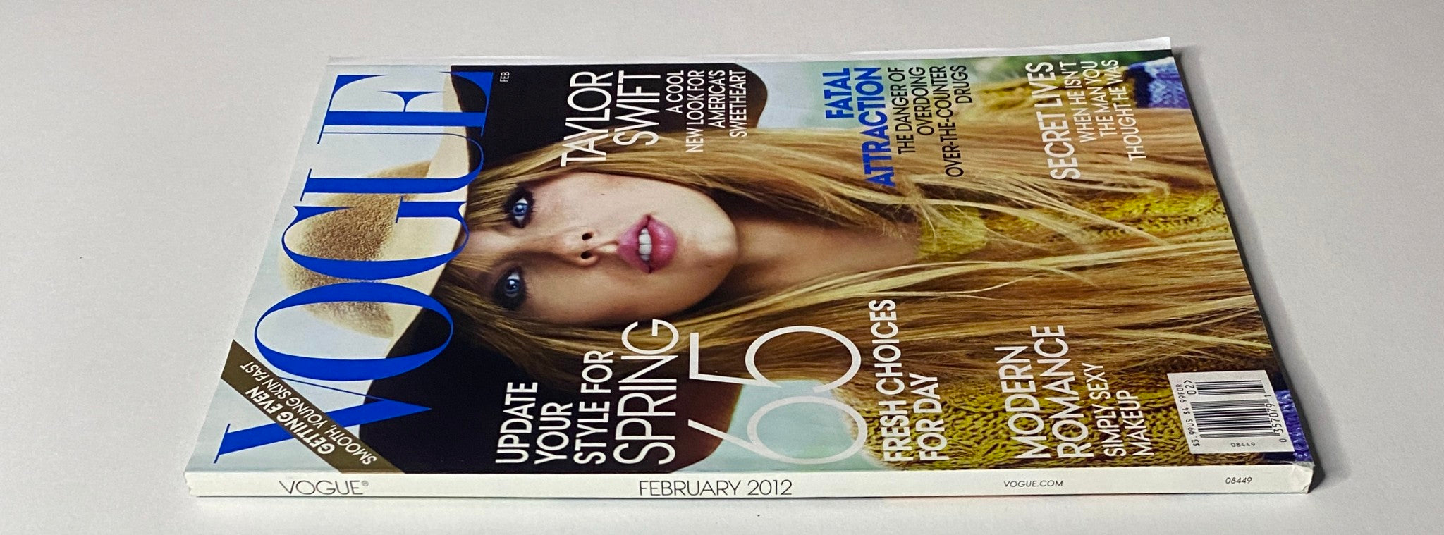 Side view of Vogue Magazine February 2012 with Taylor Swift on the cover, emphasizing spring fashion updates and contemporary style.