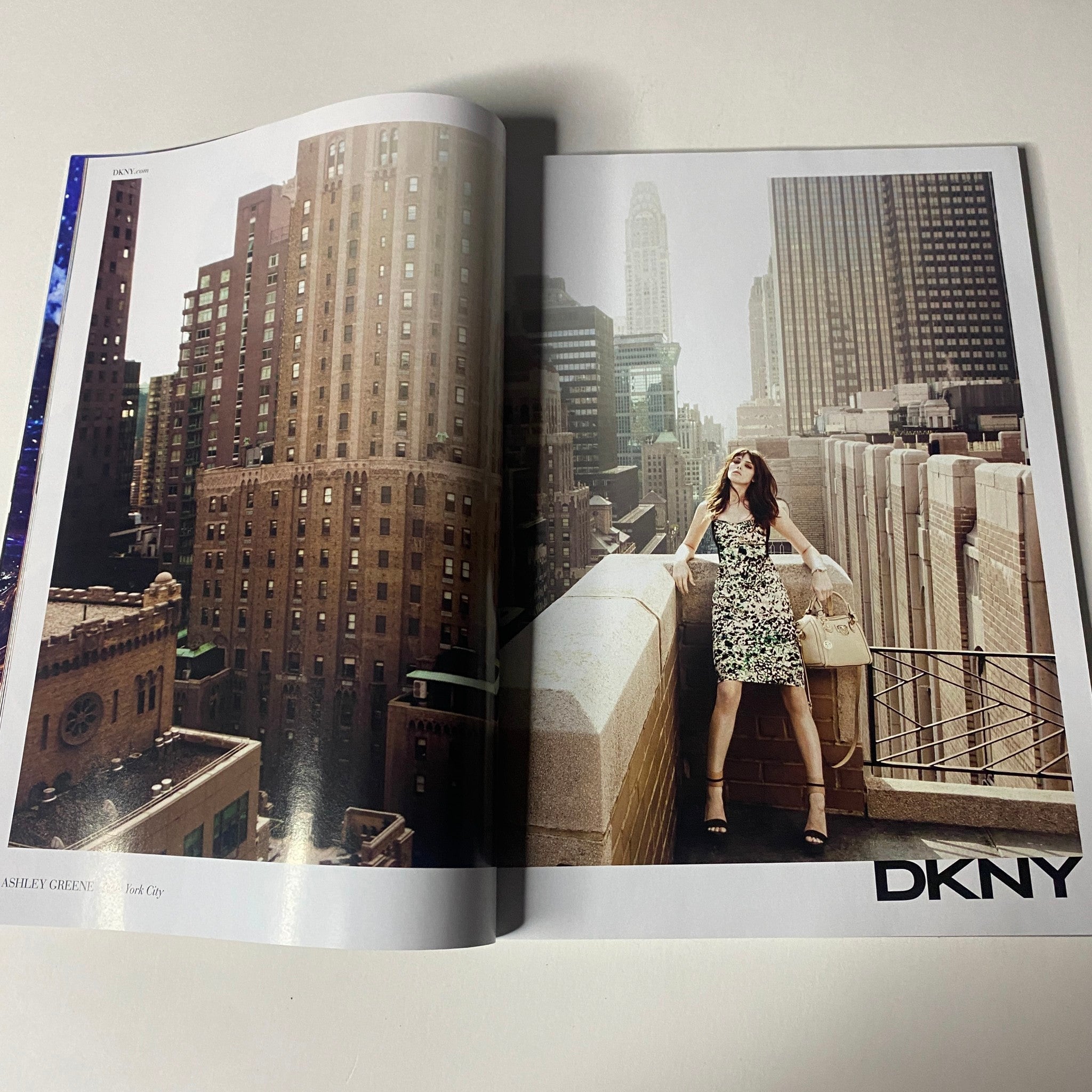 Vogue Magazine February 2012 Taylor Swift Cover No Label VG featuring a fashion editorial from DKNY, showcasing modern styles amid a city skyline.