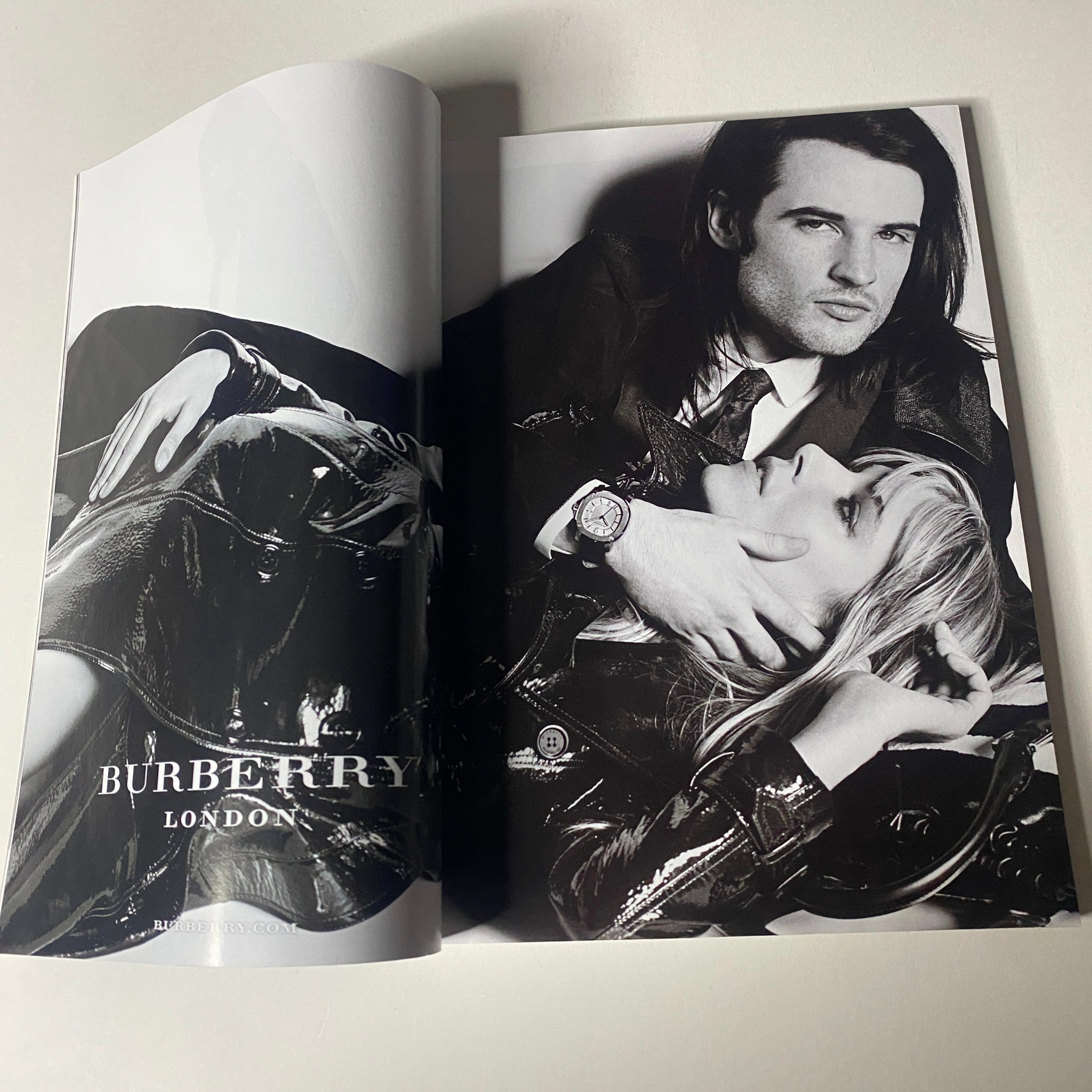 A spread from Vogue Magazine November 2013 featuring a Burberry advertisement with stylish black and white photography.