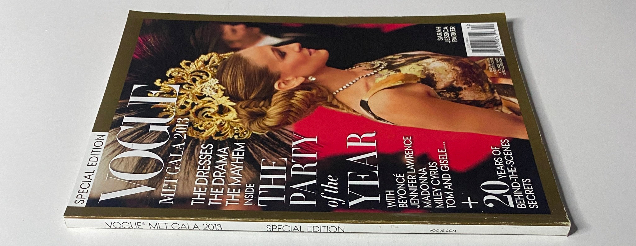 Side view of Vogue Magazine 2013 Met Gala - Sarah Jessica Parker Cover, showcasing the luxurious design and detailing of the magazine's spine and cover art.