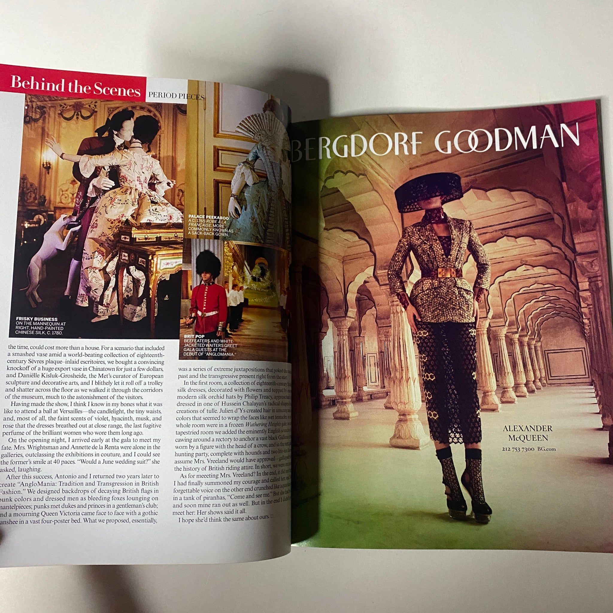 Inside spread of Vogue Magazine 2013 Met Gala, displaying an article on Alexander McQueen with an elegant design layout and captivating fashion imagery.
