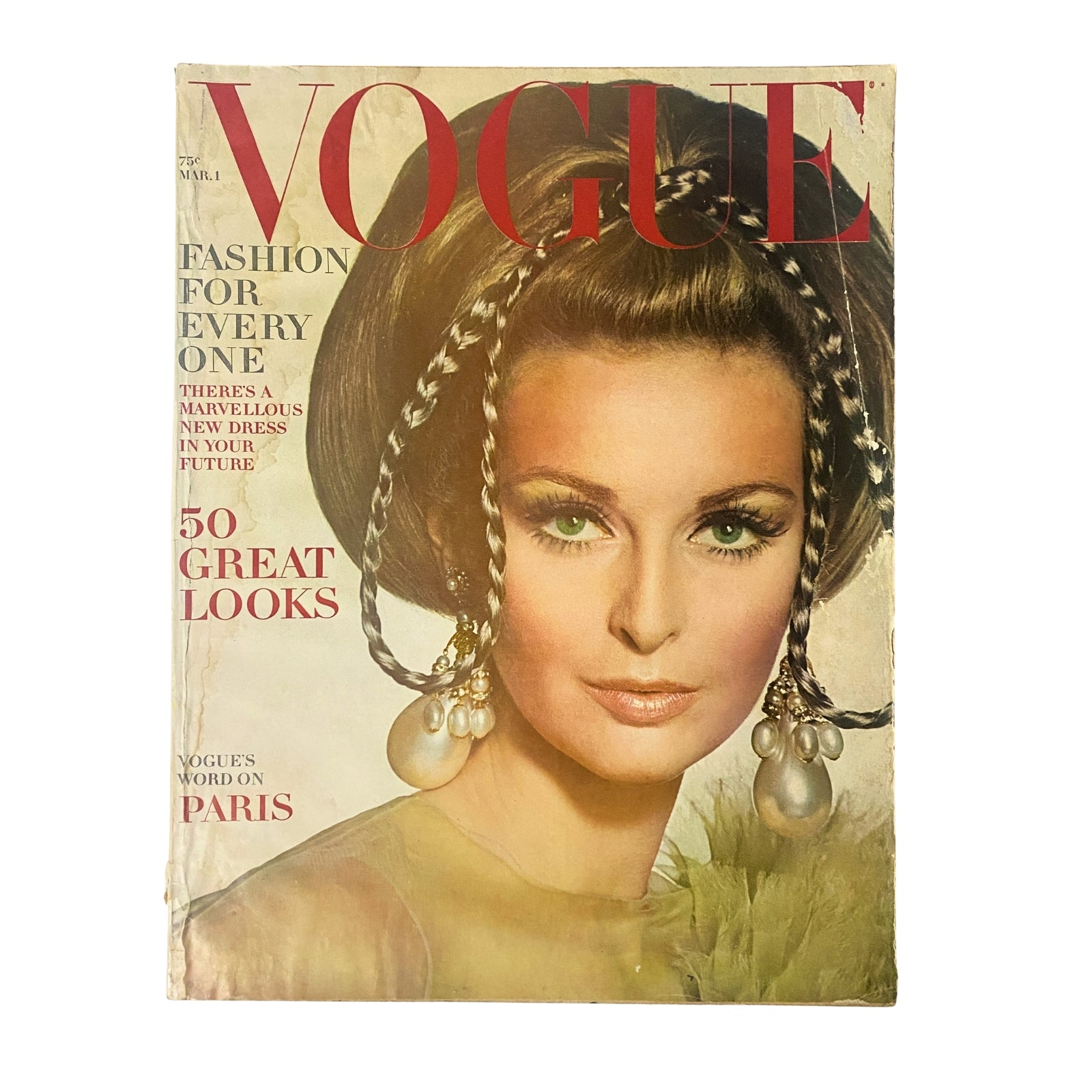 Vogue Magazine March 1, 1967 featuring Samantha Jones on the cover. The magazine showcases a striking portrait with the model styled in a dramatic hairdo and elegant accessories, reflecting 1960s fashion trends. Perfect for collectors and vintage fashion enthusiasts.