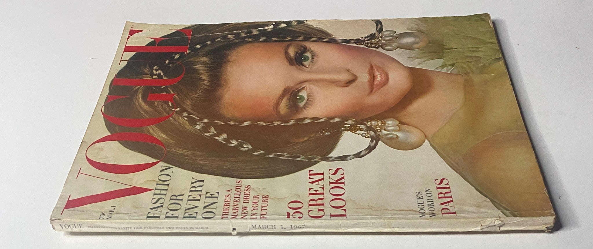 Vogue Magazine March 1, 1967 cover featuring Samantha Jones, showcasing a dramatic hairstyle and elegant makeup, reflecting 1960s fashion trends.