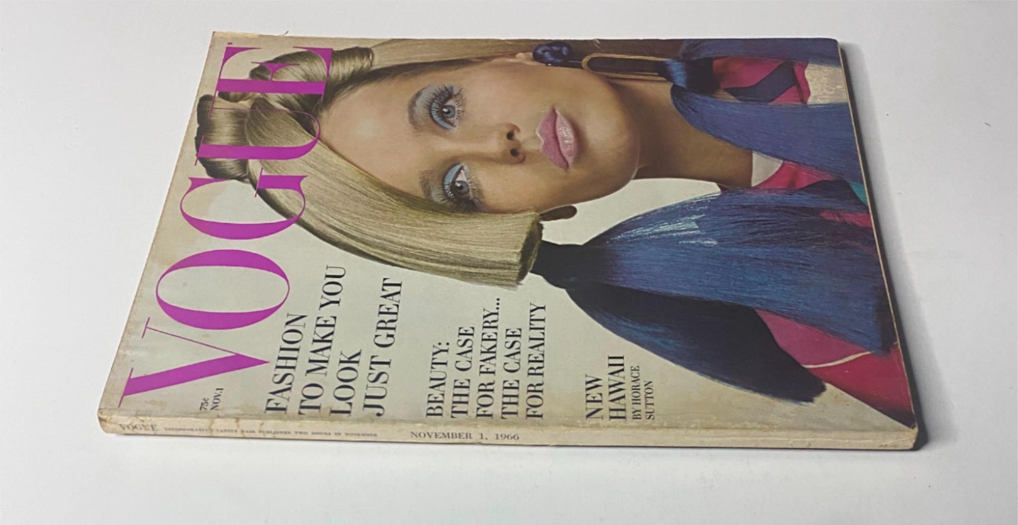 Side view of Vogue Magazine November 1, 1966, highlighting the cover model's glamorous look and vibrant colors.