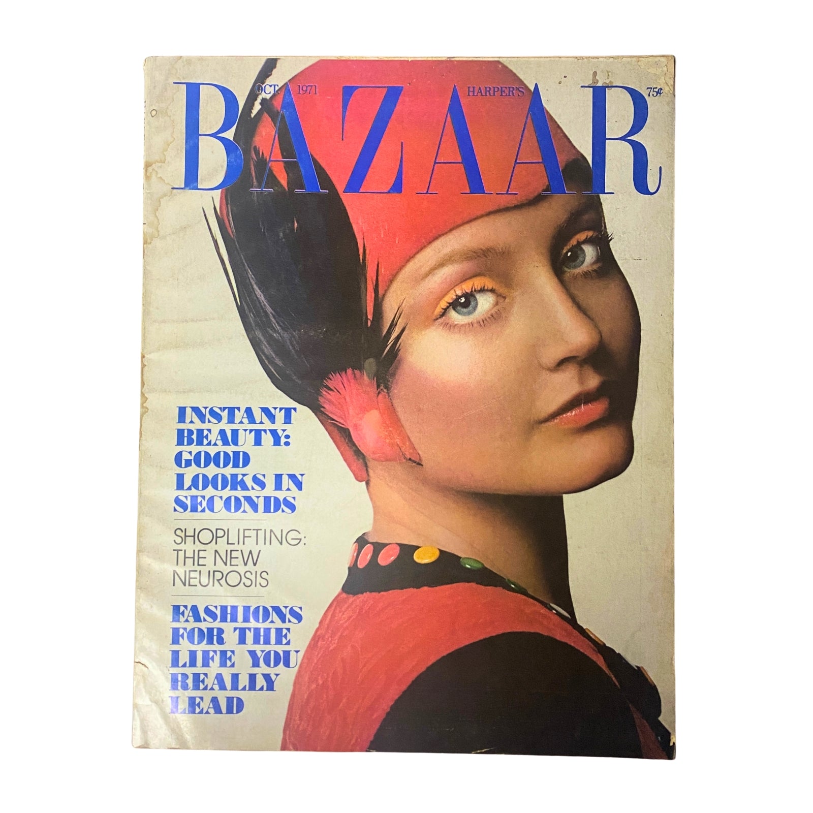 Cover of Harper's Bazaar Magazine October 1971 featuring a model with dramatic makeup and a striking headdress, illustrating the theme 'Shine and the World Shines with You'.