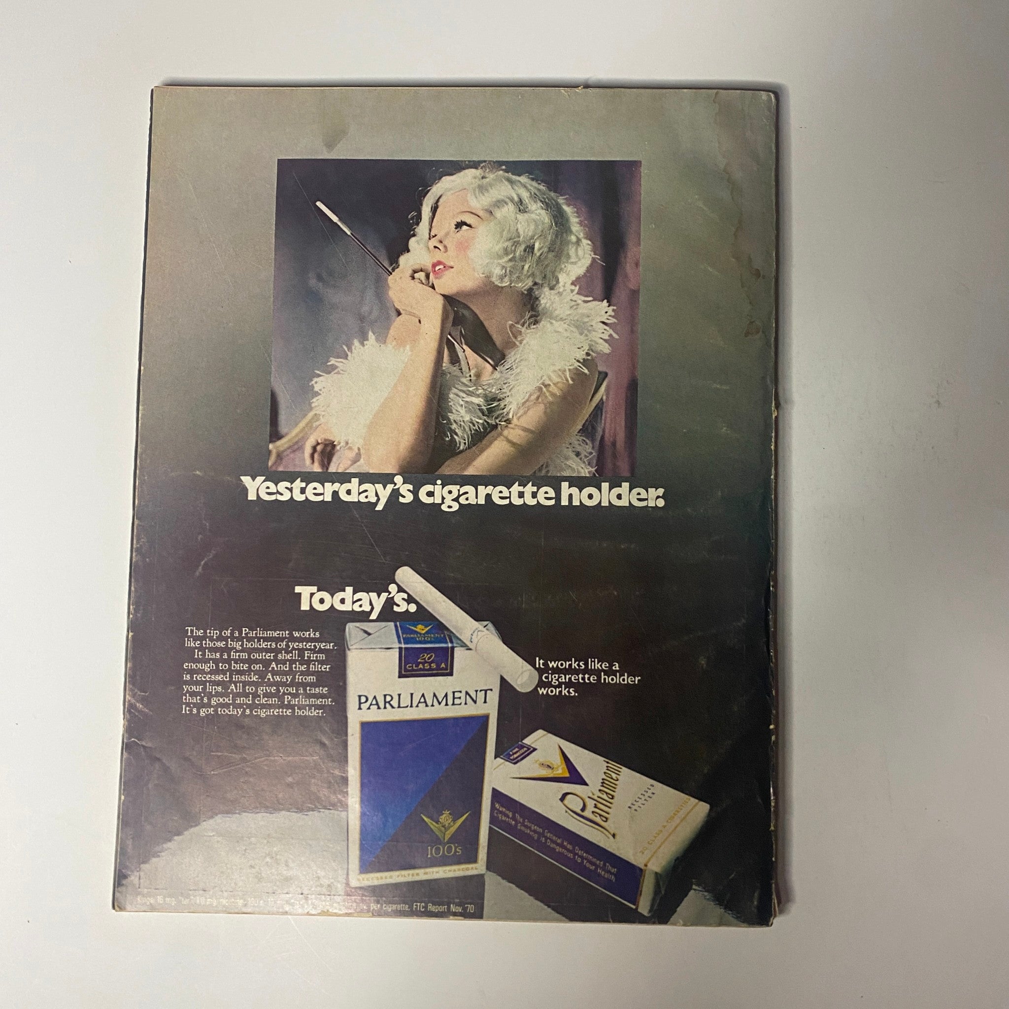 Back cover advertisement from Harper's Bazaar Magazine October 1971 for Parliament cigarette holders, emphasizing the shift from vintage to contemporary smoking accessories.